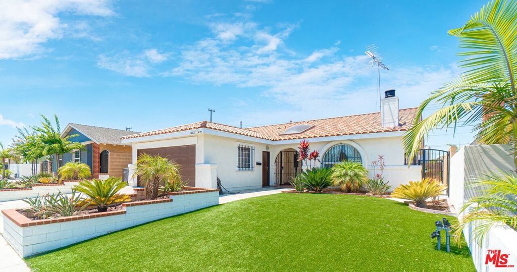 Welcome to this charming 3-bedroom, 2-bathroom Spanish-style home, offering 1,291 sq ft of inviting living space on a 4,762 sq ft lot in Carson's highly sought-after Carrousel Community. Step inside and experience the heart of this home, a tastefully upgraded kitchen boasting sleek countertops and ample cabinet space, perfect for culinary enthusiasts and entertaining alike. Both bathrooms have also been modernized with contemporary fixtures and finishes. Built in 1967, this residence retains its unique architectural charm, featuring arched entryways, windows, and a cozy fireplace in the living room. Beyond the inviting interiors, you'll find a 2-car attached garage with a dedicated laundry area and a nicely sized covered patio in the backyard, ideal for outdoor gatherings. The Carrousel Community is renowned for its friendly atmosphere, tranquility, and convenient location. Enjoy the quiet, suburban feel while being just a short drive from major highways and the vibrant attractions of Los Angeles County. Don't miss the opportunity to make this delightful Carson gem your new home!