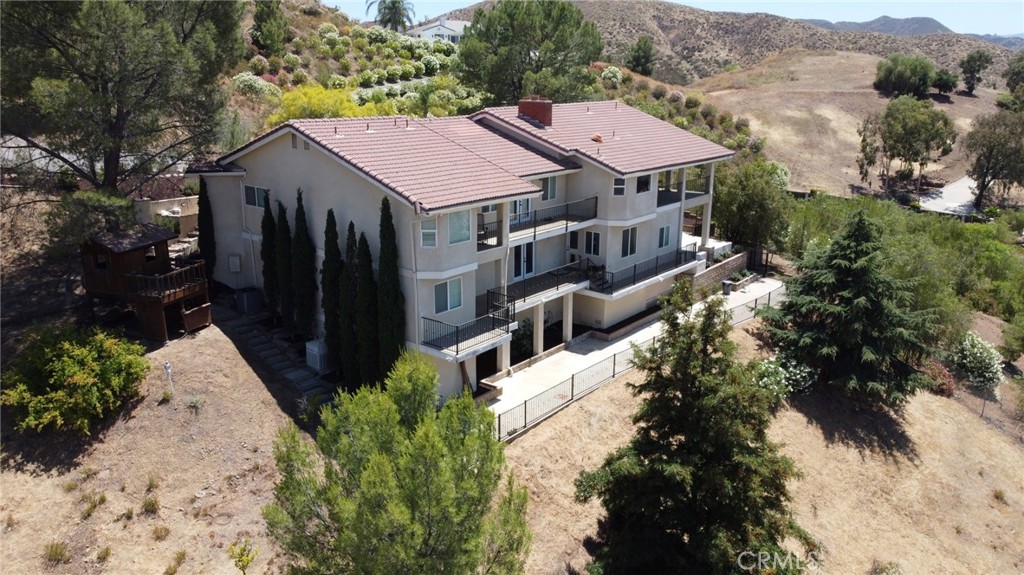 Welcome to this exceptional 4,048 sq. ft. home, fully renovated and situated on a sprawling 3.28-acre lot in the prestigious Canyon Lake Estates. This exclusive community boasts only 18 acreage estates, offering both privacy and luxury living with no close neighbors.
Featuring 4 spacious bedrooms and 4.5 bathrooms, this home is designed for comfort and elegance. Two master suites—one on each floor—provide convenience, while the additional two bedrooms come with their own private bathrooms, ensuring privacy for all family members or guests.
The heart of the home is the gourmet kitchen, perfect for entertaining. It includes two sinks, two dishwashers, and a 48" built-in refrigerator, catering to the needs of any chef. The home also offers a formal dining area, a cozy reading room, and a dedicated office space, ensuring ample room for both relaxation and productivity.
The property’s unique layout includes two living rooms, one on each floor, allowing for versatile living spaces. The front yard features an oversized driveway and RV parking, providing plenty of room for all your recreational vehicles and toys.
Included in the price is a 46-panel, fully paid-off solar system grandfathered into Net Metering 2.0, delivering long-term energy savings and locked-in utility credits no longer available under current programs.
Step outside to breathtaking views from both stories, overlooking serene Canyon Lake. What sets this property apart from the rest in Canyon Lake Estates is its rare combination of spectacular views and flat land suitable for building. While most homes in the Estates either have a view with no flat land or flat land with no view, this home offers the best of both worlds. The expansive flat areas are perfect for building additional structures, a pool, or sport courts, while the gently rolling hills present an ideal opportunity to grow a vineyard.
Zoned for horses and other animals, there is ample space to build a barn, stables, and horse arenas. An easement at the bottom of the parcel offers flexible access and a multitude of options for use. Whether you envision a tranquil retreat or an active lifestyle, this property can accommodate it all.
This unique home combines luxury, functionality, and the beauty of nature, making it a rare find in the coveted Canyon Lake Estates. Don’t miss the opportunity to own a piece of this exclusive community with some of the best views, ultimate privacy, and versatile land options available.