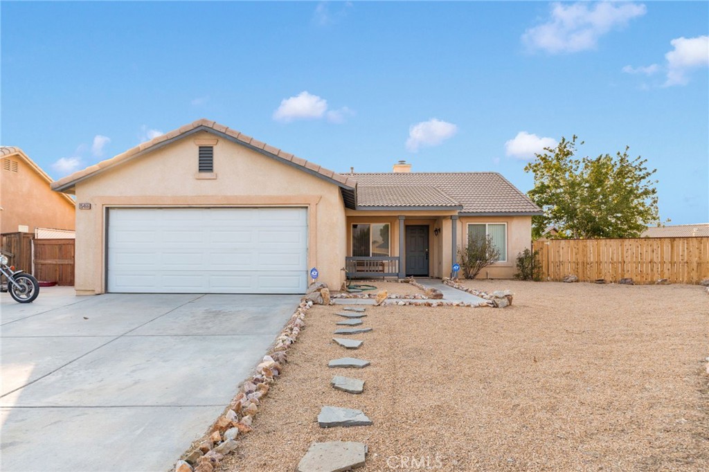 This charming Adelanto home sits on a spacious center lot and features a front yard low-maintenance rock landscape, perfect for easy upkeep year-round. In the back yard enjoy your very own cherry tree and grapevines. With its generous lot size and unique outdoor features, this property offers both convenience and character in a great location.
