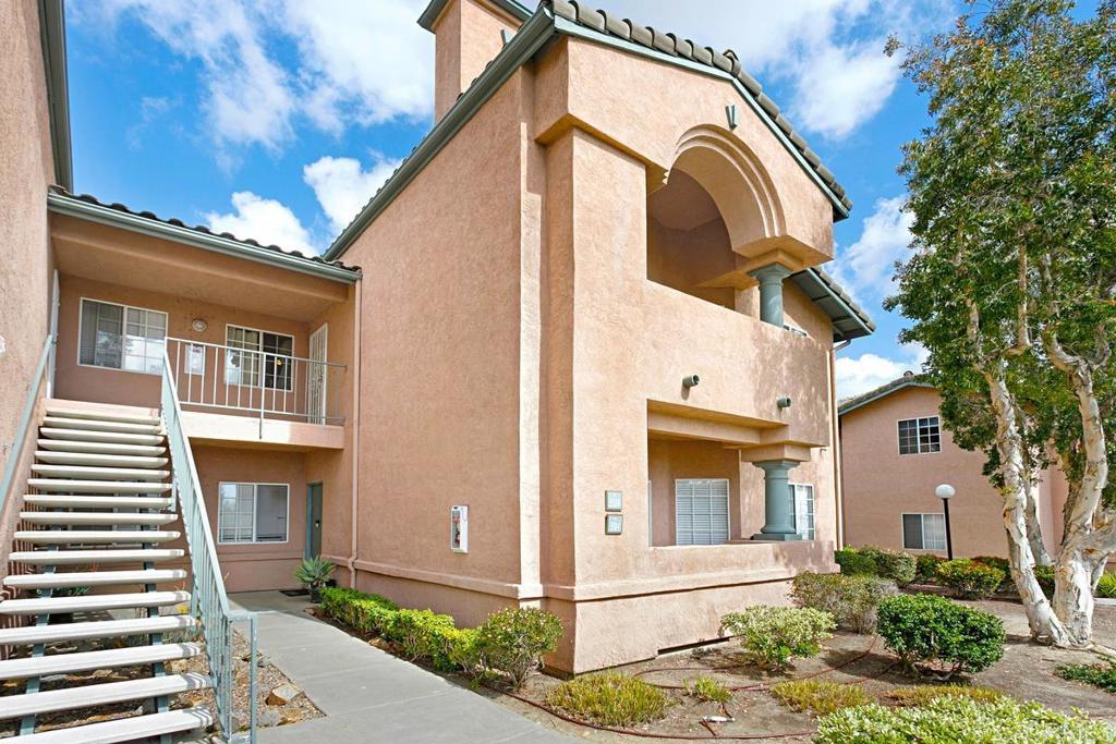 Welcome to this bright and spacious 3-bedroom, 2-bathroom upper-level condo in the highly desirable 4S Ranch area. Located in a tranquil community, this home features vaulted ceilings, hardwood laminate flooring throughout, and a cozy fireplace. Granite countertops in the kitchen add a touch of elegance. The refrigerator is brand new, and the unit includes a washer and dryer for your convenience. Enjoy breathtaking views from your private balcony and take advantage of the community amenities, including a pool, spa, gym, and tennis courts. This home also comes with a one-car garage plus an additional covered parking space. Perfectly situated close to shopping, parks, and top-rated Poway Unified schools. HOA covers water, trash, and sewer. Owner pays HOA fees; tenant is responsible for gas and electric. No smoking. Small pets welcome.