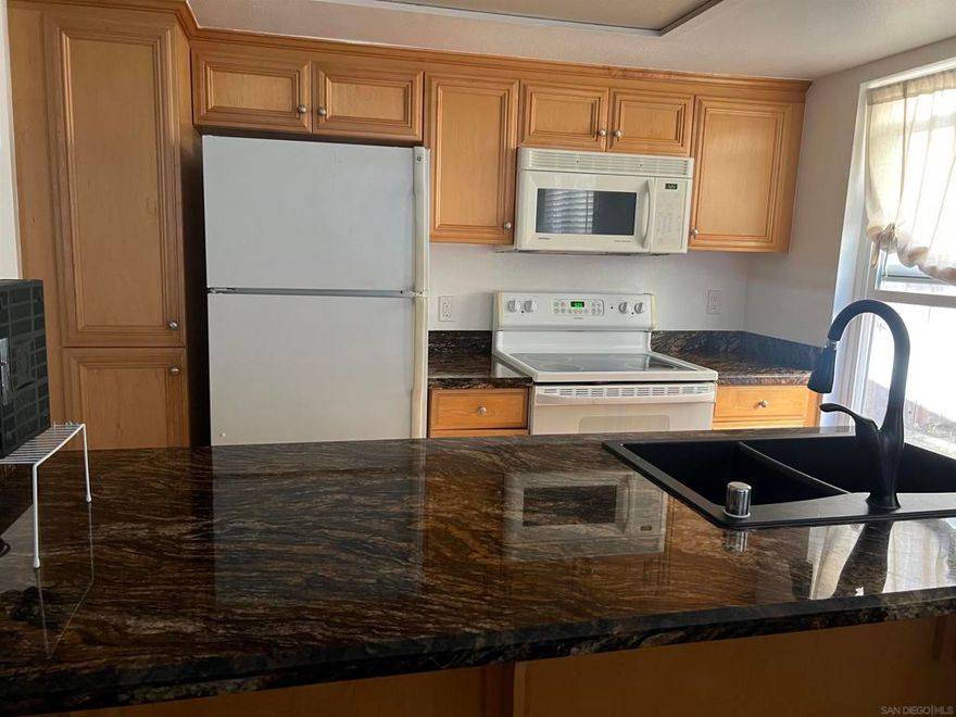 Welcome to Menlo Village, a quiet, gated condo community centrally located in San Diego’s vibrant College Area. Just minutes from San Diego State University, this neighborhood offers unparalleled access to shopping, dining, parks, and public transit. Enjoy the convenience of living in a community where everything you need is just a short walk or drive away.  This corner unit 2-bedroom, 2-bathroom condo features approximately 800 square feet of thoughtfully designed living space, abundant natural light, and an open floor plan ideal for comfortable living and entertaining.  Additional perks include two assigned, secure underground parking spaces and central air conditioning for year-round comfort. Menlo Village provides a peaceful gated setting while keeping you connected to the best urban amenities San Diego has to offer, including quick freeway access and proximity to cultural and recreational hotspots.