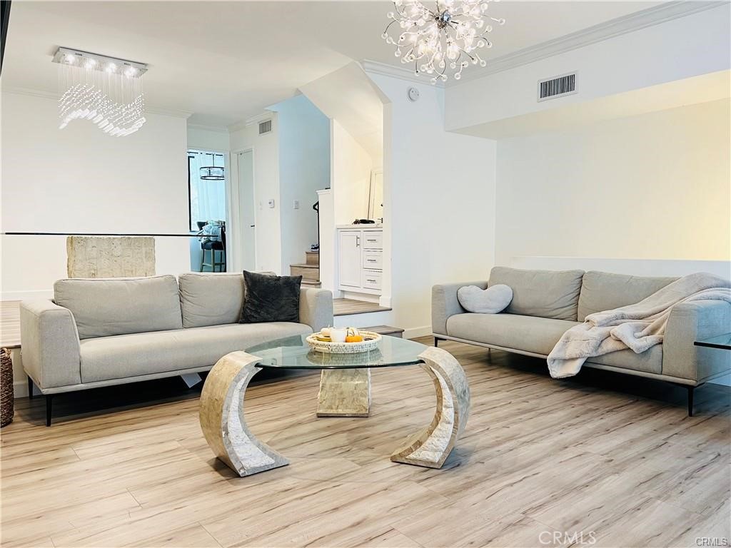 Discover the epitome of luxury in this immaculate 2-bedroom plus bonus room, 2.5-bathroom townhome situated in the heart of Sherman Oaks. Step into the spacious living room adorned with laminate flooring, a re-imagined fireplace featuring new stonework, recessed lights, and convenient access to a private fenced patio. The chef's kitchen boasts stone countertops, ample cabinet space, a breakfast area, and stainless steel appliances. Entertain seamlessly in the formal dining room with a wet bar opening to the living space. Upstairs unveils two master suites with stunning carpeted floors and en-suite bathrooms. The primary bedroom is a sanctuary with vaulted, beamed ceilings, a large walk-in closet, built-ins, and a balcony. The lower-level bonus room, with direct access to a 2-car garage, offers versatile possibilities as a home office, gym, or guest room. This well-kept 19-unit community features mature landscaping, a pool, spa, rec room, and a park-like grassy area at the rear of the property. Perfectly located with Westfield Fashion Square, Sherman Oaks Park, and Trader Joe’s just moments away, enjoy the ultimate in sophisticated living with easy access to the 101 and 405 freeways. Your dream home awaits!