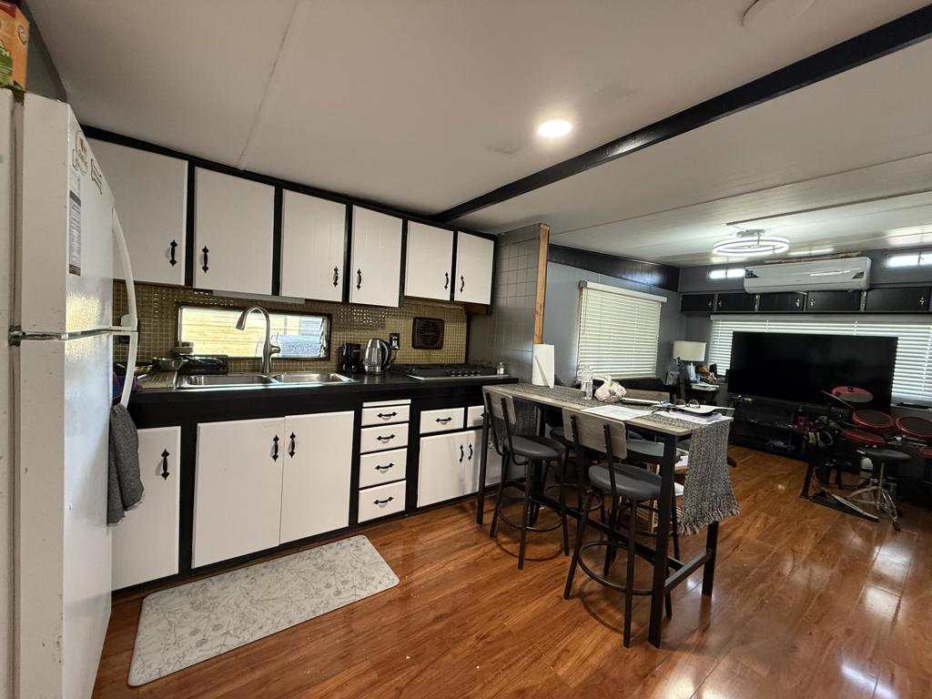 Discover this beautifully upgraded 4-bedroom, 1-bathroom manufactured home located in Healing Sands Mobile Home Park, an all-age gated community in Desert Hot Springs. This residence combines comfort, style, and affordability. Experience the elegance of laminate flooring, modern lighting, and upgraded electrical outlets, complemented by fresh paint and a recently refinished kitchen. Additional features include two exterior storage units, a laundry room equipped with a washer and dryer, and a covered carport accommodating two vehicles. Enjoy community amenities such as a pool, spa, and laundry facilities.