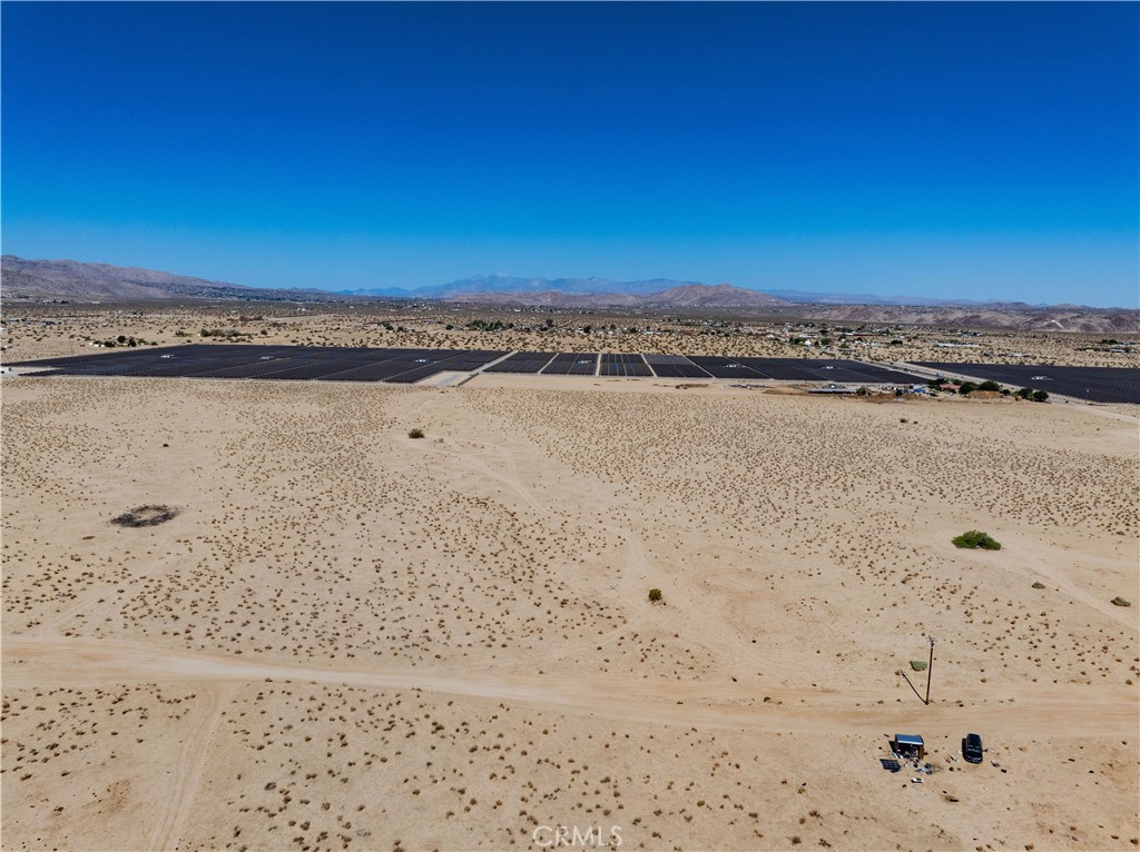 Opportunity awaits with this expansive 10-acre parcel located in the desirable Sunfair West area of Joshua Tree! With power poles conveniently located in the street, this property is an excellent choice for those looking to build a desert getaway, dream home, or invest in the fast-growing Hi-Desert region.
Enjoy panoramic views, stunning sunsets, and wide open space—all just a short drive to downtown Joshua Tree, local amenities, and the entrance to Joshua Tree National Park. Whether you're planning a custom build or looking to hold onto land in a prime location, this parcel offers the space and potential to bring your vision to life. Don’t miss your chance to own a piece of the peaceful and inspiring Mojave Desert. It is the buyer’s sole responsibility to verify access to utilities (including water and power), zoning designations, and applicable county or city building requirements. Buyers are advised to perform thorough due diligence and consult with appropriate licensed professionals to ensure the property meets their needs and intended use.