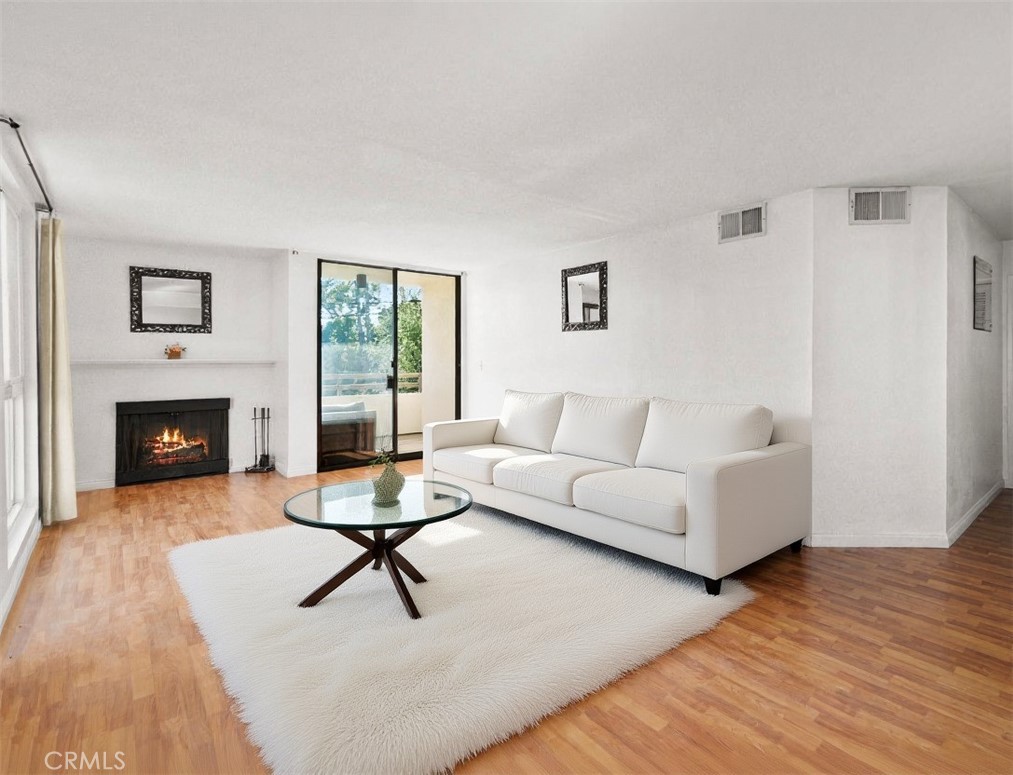 Welcome to this stunning top-floor penthouse condo in the heart of prime West Hollywood! This beautifully updated 2-bedroom, 2-bathroom unit offers a rare opportunity to own a move-in-ready home in one of LA’s most sought-after neighborhoods.
Flooded with natural light, the open-concept living space boasts soaring ceilings, sleek hardwood floors, and a modern fireplace that creates a warm and inviting atmosphere. The expansive living and dining areas seamlessly flow out to a private balcony with treetop views — perfect for morning coffee or evening relaxation.
The recently updated kitchen features stainless steel appliances and contemporary cabinetry, ideal for both cooking and entertaining. The spacious bedroom includes generous closet space, while the renovated bathroom showcases a stylish vanity and modern fixtures.
Located in a quiet, well-maintained, pet-friendly building, residents enjoy secured access, 24/7 CCTV surveillance, gated side-by-side parking, and a suite of premium amenities — including a sparkling pool, fully equipped gym, sauna, recreation room, and on-site laundry facilities.
Just moments from Melrose Avenue, Sunset Strip, and Santa Monica Blvd, you'll enjoy walkability to trendy cafes, world-class restaurants, designer boutiques, and vibrant nightlife. Whether you're a first-time buyer, investor, or looking for a chic pied-à-terre in the city, this West Hollywood gem delivers on location, comfort, and lifestyle.
Don’t miss out — schedule your private showing today and experience the best of LA living!