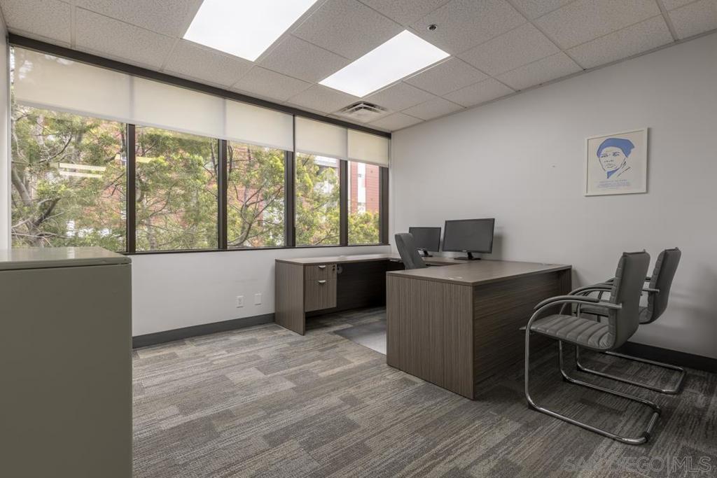 Discover an exceptional office rental opportunity in the heart of Downtown San Diego! INDIVIDUAL, PRIVATE PROFESSIONAL OFFICES FOR RENT within a fully functioning and all inclusive office suite. This 1,700-sqft suite offers 8 individual offices, each for rent separately, with a professional and fully equipped environment ideal for businesses seeking a prestigious address with convenience and comfort. Amenities included in rent: Front desk receptionist to greet visitors and accept packages during specific hours, high-speed internet broadband, gas and electricity utilities, business mailing address, nightly janitorial service, access to community lunchroom, professional scanning and printing equipment (limited monthly photocopies), and document shredding services. This office is ideal for any professional services, legal teams, startups, or any businesses seeking a modern, move-in-ready space in a central and vibrant location downtown. Schedule a tour today and secure your spot in one of San Diego’s most sought-after commercial hubs! Suite 325-5 is an exterior-facing, window office, sized 12' x 13' for an approximately 140-square foot, locked off, private room that only you can access or use. It also includes access to the remaining 700+ square feet of community, reception, and printing space within the shared suite area. along with access to all building amenities. The only item not included in rent is optional parking, which costs $180/month/space in a secured, non-reserved garage attached to the building. Exceptional Office Space in the Heart of Downtown San Diego – 1,700 Sq. Ft. total space, 8 individual offices | Individual Offices for Rent in a Suite! Position your business for success with a beautifully maintained and fully functional office suite located in the vibrant core of Downtown San Diego's Cortez Hill. Designed for productivity, professionalism, and comfort, this space is ideal for companies looking to establish themselves in a prestigious and well-connected business district. The suite features eight private, individual offices available and a welcoming front desk/reception area, creating an ideal layout for teams of professionals, legal practices, startups, and client-facing businesses. Whether you're expanding or seeking a high-quality satellite location, this suite offers all the essentials for a seamless move-in experience. Included Amenities: Front reception desk attendant Internet, gas, and electricity utilities included—fewer bills to manage Mailing address for business use, adding credibility to your operations Nightly janitorial service for a consistently clean and professional space Modern lunchroom that’s pristine, inviting, and perfect for breaks or informal team gatherings Access to scanning equipment Limited monthly photocopies to support daily operations Secure document shredding services for confidential disposal Parking for an additional $180 per month per space Select offices feature stunning views of Downtown San Diego and the southern tip of Balboa Park, creating an inspiring workspace for you and your team. Whether you're meeting with clients, collaborating with colleagues, or focusing on solo work, this office offers the infrastructure and environment to support your growth. Don’t miss the opportunity to work in one of San Diego’s most sought-after commercial hubs. Schedule your tour today and take the next step for your business.