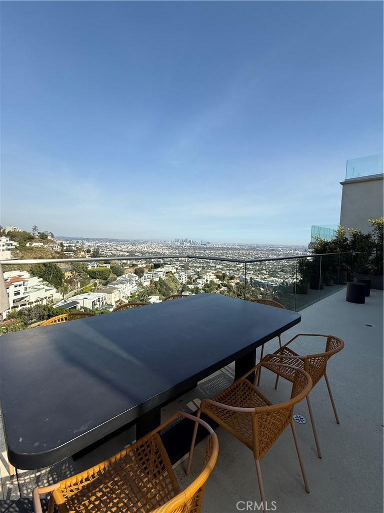 Step into a breathtaking open-concept living space featuring soaring ceilings, a spacious dining area that comfortably seats eight, and sweeping jetliner views of the hills and downtown skyline. The chef’s kitchen is a true showpiece, outfitted with top-of-the-line Miele appliances, custom cabinetry, and a large island with a farmhouse sink, ideal for both everyday living and entertaining.
Massive stacking glass doors seamlessly connect the interior to a generous deck, offering direct access to two additional rooftop terraces—perfect for al fresco dining, stargazing, or simply soaking in the panoramic vistas.
One bedroom is conveniently located on the main level. The resort-style primary suite boasts a spa-inspired bathroom, private balcony with hillside and city views, and an outdoor hot tub for the ultimate in relaxation. An additional en-suite bedroom is also located on this level.
On the lower level, a separate entrance opens to a versatile living space with a private en-suite bedroom. This floor also features a dedicated TV room, a music room, and an additional guest bedroom, ideal for hosting or multi-generational living.
Luxury finishes and smart home technology are found throughout the home, including zoned Nest HVAC, a Nest Protect system, video doorbell with remote and contactless entry, recessed LED lighting, and elegant hardwood flooring. Each room is equipped with an Apple HomePod, fully integrated with Siri for voice-controlled convenience.
Offered fully furnished, this turn-key retreat blends modern comfort with sophisticated design, an exceptional residence ready to enjoy from day one.