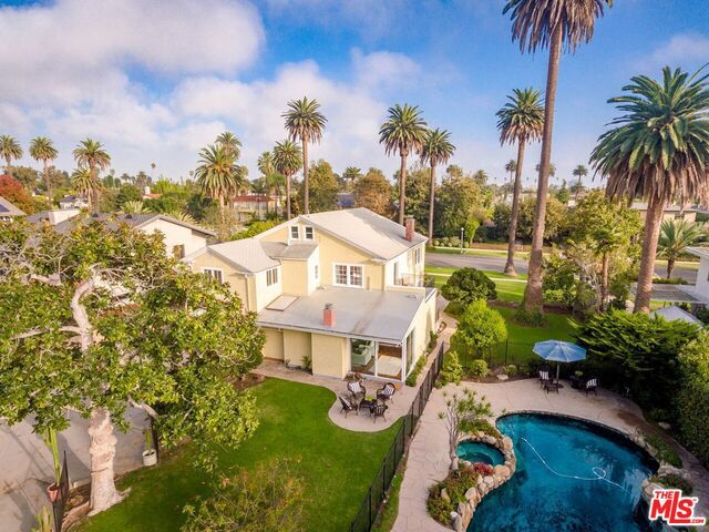 Endless possibilities surround this very special home on a breathtaking 1/2 flat acre. Personalize, expand or start anew. The lot boasts 103 feet of frontage and is 219 feet deep with a front driveway and alley access. Beautiful original details throughout the home include original coffered ceilings, wainscoting, formal parlor, dining room and grand scale bedroom proportions. There is even a full height attic that can be utilized for additional living space. The sprawling yard includes a pool, cabana and plenty of wide open paradise left to your imagination. All a hop, skip and jump to exquisite Palisades Park, Goose Egg Park, the Santa Monica Stairs and Annenberg Community Beach House, endless shopping, dining and conveniences on Montana Avenue. This home does not meet landmark criteria.