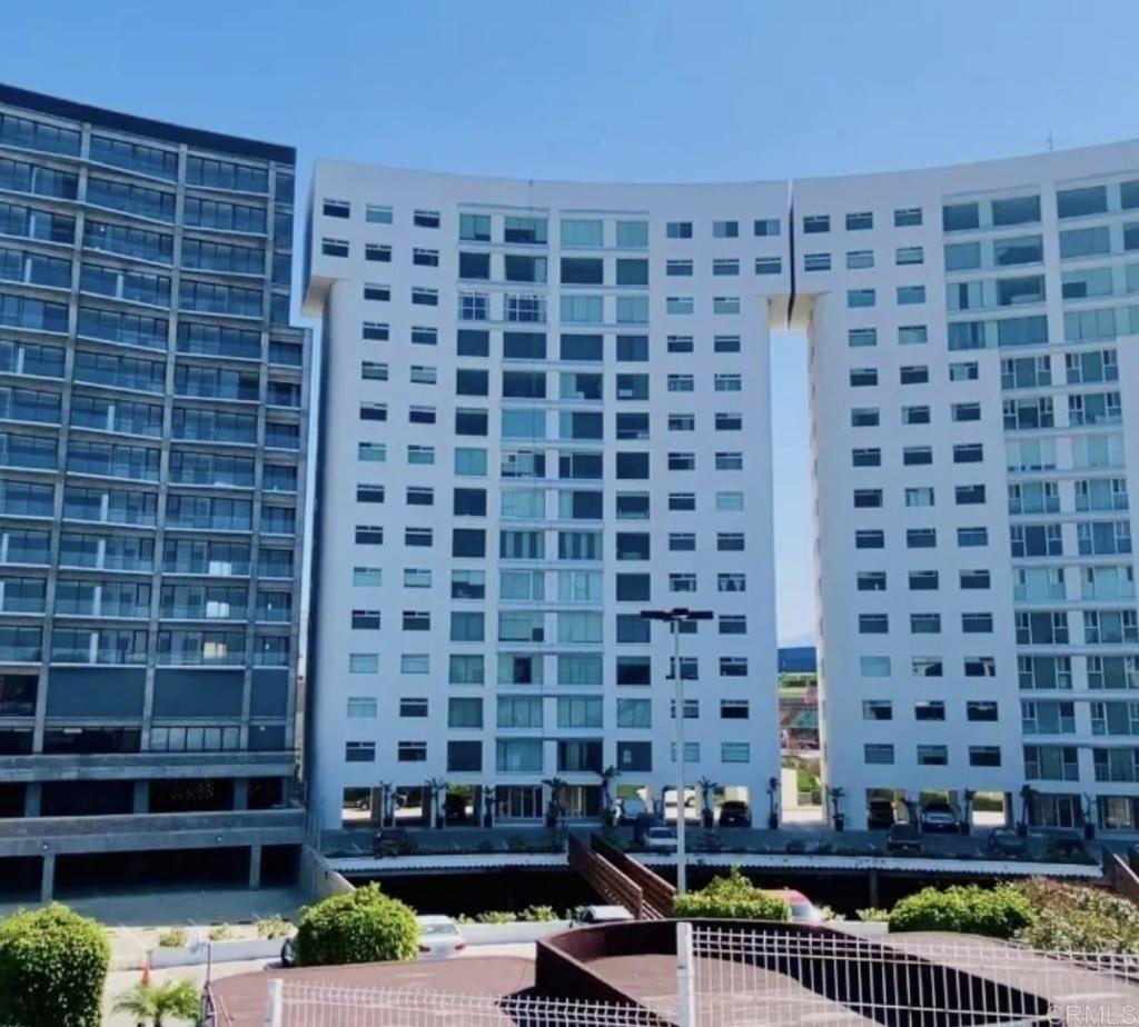 Luxurious Coastal Retreat with Breathtaking Panoramic Views at Park Towers, Playas de Tijuana Discover elevated living in this stunning 10th-floor apartment, offering an expansive 1,786.81 square feet of sophisticated space in the prestigious Park Towers, Playas de Tijuana. Perfectly blending modern elegance with coastal charm, this residence boasts unparalleled panoramic views that capture the serene beauty of the Pacific Ocean and vibrant cityscape. Key Features: Spacious & Modern Layout: This 3-bedroom masterpiece includes a generous walk-in closet in the primary suite, designed for ultimate comfort and storage. With 2.5 beautifully appointed bathrooms, every detail exudes luxury. Gourmet Kitchen: The heart of the home features a sleek granite kitchen with a central island, perfect for culinary creations and entertaining.  Entertainment Haven: Unwind in the dedicated TV room, a cozy retreat for movie nights or relaxing with loved ones. Exclusive Amenities: Enjoy the convenience of two reserved parking spaces and peace of mind with 24/7 security guard service, ensuring safety and ease in this upscale community. Prime Location: Nestled in the sought-after Playas de Tijuana, Park Towers offers proximity to pristine beaches and vibrant dining. This is more than an apartment—it’s a lifestyle. Whether you’re savoring morning coffee with ocean views or entertaining guests in your chic, open-concept living space, this residence delivers unmatched sophistication and comfort. Please book an appointment, and take a look at this jewel. yourself