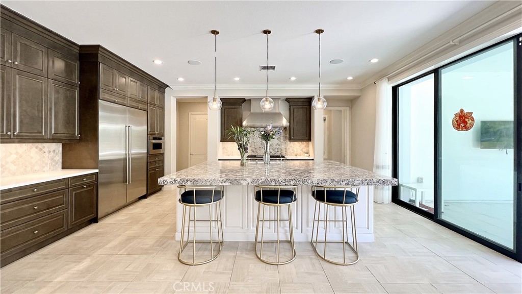 Beautiful, two-story, luxury home with a large backyard. The owner did the whole UPGRADE including Hardwood floors on the first floor and tile floors on the first floor. This home is built in the 24-hour guard-gated neighborhood of Altair in Irvine. Toll Brothers constructed this building. This 5 bedroom, 5.5 bathrooms, with a special bonus flex area, was just finished in 2018. It features an office on the main level, high ceilings, and abundant natural light. The stunning double staircase, fresh paint, and an airy, open floor plan that smoothly connects the kitchen and living area invite you as soon as you enter. Open to a Private are the Upgraded Glass Sliding Doors. In the well-appointed gourmet kitchen, there is a sizable center island with a breakfast bar that wraps around it which features a sizable refrigerator, a microwave, a wine cabinet, and a washer and dryer on the first. The spacious master bedroom has a large living area and an additional room for a walk-in California closet which the owner upgraded the cabinet. The community amenities have Junior Olympic Pools, Sports Court, Tennis Court, Clubhouse, and Hiking/Biking Trails. Irvine Unified School District, which has won awards, is the school system. Only a short distance from the Woodbury Shopping Center, the Irvine Spectrum Center, and the 133 Toll Road.
