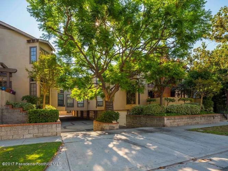 Elegant Townhome Living in the Heart of Madison Heights!  Welcome to your beautifully remodeled townhome, perfectly situated in the highly sought-after neighborhood of Madison Heights, Pasadena. Just minutes from Old Town Pasadena, Paseo Colorado, Trader Joe's, Whole Foods, and convenient Metrolink access, this home blends modern comfort with exceptional urban convenience.  Step inside to a warm and inviting step-down living room featuring soaring ceilings, rich wood flooring, and a wood-burning fireplace with gas starter--the perfect setting for cozy evenings. A flexible adjoining space offers room for a home office or sitting area, opening to a private patio ideal for morning coffee or quiet relaxation.  The renovated kitchen shines with Quartz countertops, Shaker-style cabinetry, recessed lighting, and abundant storage. The sunlit dining area--unique to this unit--features an elegant breakfast bar, creating a natural hub for gatherings and entertaining.  Upstairs, light pours in through multiple skylights, highlighting all-new flooring and a convenient laundry area. The primary suite boasts a beautifully updated ensuite bath and generous closets, while a second bedroom suite provides comfort and privacy for guests or family.  Thoughtful upgrades include complete PEX re-piping (2015), new interior paint (2025), a newer HVAC system (2017), and a two-car attached garage with ample built-in storage. Impeccably maintained and move-in ready, this Madison Heights gem combines timeless elegance, modern updates, and a truly unbeatable location.