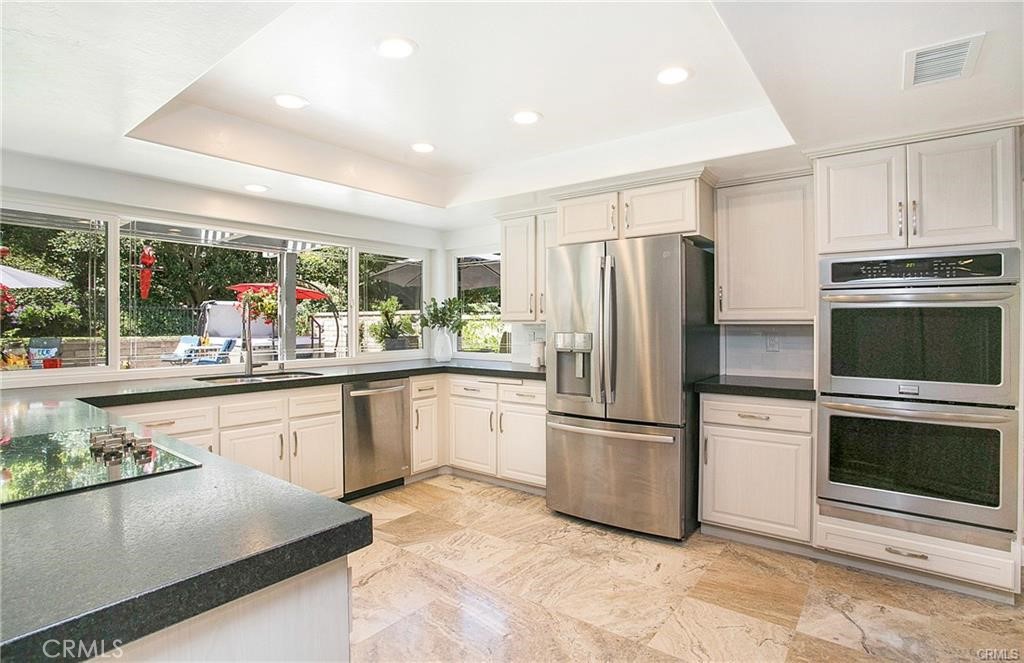 This is a wonderful house in the highly desirable Madrid neighborhood! Featuring New PEX Piping, New AC & Heater, New Patio Covers, New Carpet, New Wood Flooring, New Paint, New Granite Counters & Range. Large bright living room and formal dining room. Open concept kitchen with granite countertops, stainless appliances, and double oven. Adjoining the kitchen is a large family room with a beautiful fireplace looking out onto the oversized professionally landscaped backyard perfect for entertaining with covered patio and your own putting green. This 5 bedroom 3 bath home offers one guest suite and a full bath downstairs which has its own outside access. Master suite features a newly remodeled master bath which includes a large walk-in shower with dual shower heads, soaking tub, dual vanity sinks, and his and her closets. Three additional oversized bedrooms are upstairs with another full-size bathroom. If you're looking for peaceful surroundings for your art or music studio or you desire a warm, great place to raise your kids, look no further. Cecelia is truly one of the quietest streets in Mission Viejo. You will love your lake access; whether you like blanket-picnics during the live concerts, family movies on the lake, kayaking on the water, or simply hanging out on the beach with your friends.