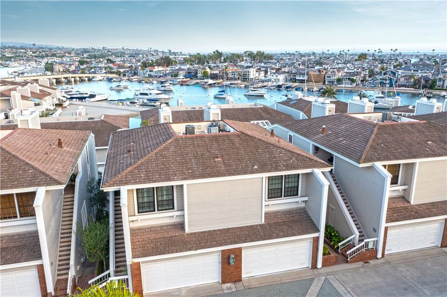 Experience Bayside Cove Luxury Living

Settled within the private gates of Bayside Cove, this newly renovated 2,180 square foot, three-bedroom, two-and-a-half-bathroom condominium offers an unparalleled blend of sophistication and comfort. Set in one of Newport Beach’s most coveted waterfront communities, it promises an enviable lifestyle where every day feels like a getaway. step inside to discover all-new floating wood laminate flooring, elevating the space with contemporary warmth and style. The heart of the home is the gourmet kitchen, beautifully appointed with quartz countertops and an elite suite of commercial-grade appliances, including a Subzero refrigerator, Wolf range, and Bosch dishwasher. Whether you’re hosting friends or preparing a quiet meal, the kitchen’s thoughtful design inspires culinary creativity. Gather in the cozy living room, anchored by a charming fireplace that invites relaxation and conversation any time of day. Adjacent, a stylish bar area with a built-in wine fridge sets the scene for memorable evenings and effortless entertaining. Each element has been crafted for both comfort and elegance, creating a welcoming haven to call home. Step out onto the expansive viewing deck and let your gaze sweep across the sparkling waters of Beacon Bay. This west-facing vantage point offers front-row seats to breathtaking sunsets and the tranquil beauty of Balboa Island and Newport Harbor. Whether savoring a quiet morning coffee or celebrating with friends, the deck is your gateway to coastal serenity. As a resident of Bayside Cove, you’ll enjoy exclusive access to a private beach, a resort-style swimming pool, and a soothing spa—perfect for active afternoons or peaceful relaxation. The community’s lush landscaping and secure environment provide a sense of tranquility and belonging. Just moments from your door, the vibrant shops, cafés, and acclaimed restaurants of Balboa Island await, offering endless opportunities for dining, shopping, and leisure. For boating enthusiasts, Villa Cove Marina is close by, making it easy to embark on a sunset cruise or dock your vessel. Imagine ending each day with the glow of the setting sun reflected over Newport Harbor, whether from your deck or the comfort of your own boat. Luxurious, welcoming, and perfectly positioned for the best of Newport Beach, this Bayside Cove condominium is more than a home, it’s your invitation to an inspired coastal lifestyle. Most all furnishings included. Not Primary furniture