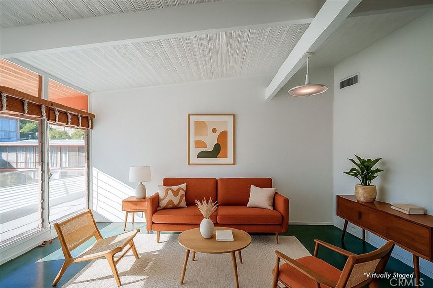 A rare opportunity to own a true piece of Los Angeles architectural history at the legendary Hollywood Riviera, designed in 1954 by Edward Fickett, renowned leader of modernism. This unit features the authentic mid-century amenities, including signature beamed ceilings, paneled walls, and green-toned concrete floors that echo the era’s minimalist modernism.Perched on the top floor, this west-sunset facing unit is flooded with natural light with oversized floor-to-ceiling windows offering views of lush greenery and the building’s bold mid-century lines. Includes a classic bathroom with tiled shower/tub combo, and a spacious living room perfect for showcasing your modernist aesthetic.The open-concept layout is rarely available in condominium construction and more prevalent with single family homes; best of both worlds...price and style. Enjoy the charm of the timeless fixtures and the potential to restore or modernize with your personal touch. The building features tropical landscaping, a resort-style courtyard pool, secure entry, community laundry, EQ insurance, and Mills Act benefits for significant property tax savings.  Just a block off the Sunset Strip, this is quintessential West Hollywood living—architecturally iconic, culturally vibrant, and impossibly well-located.