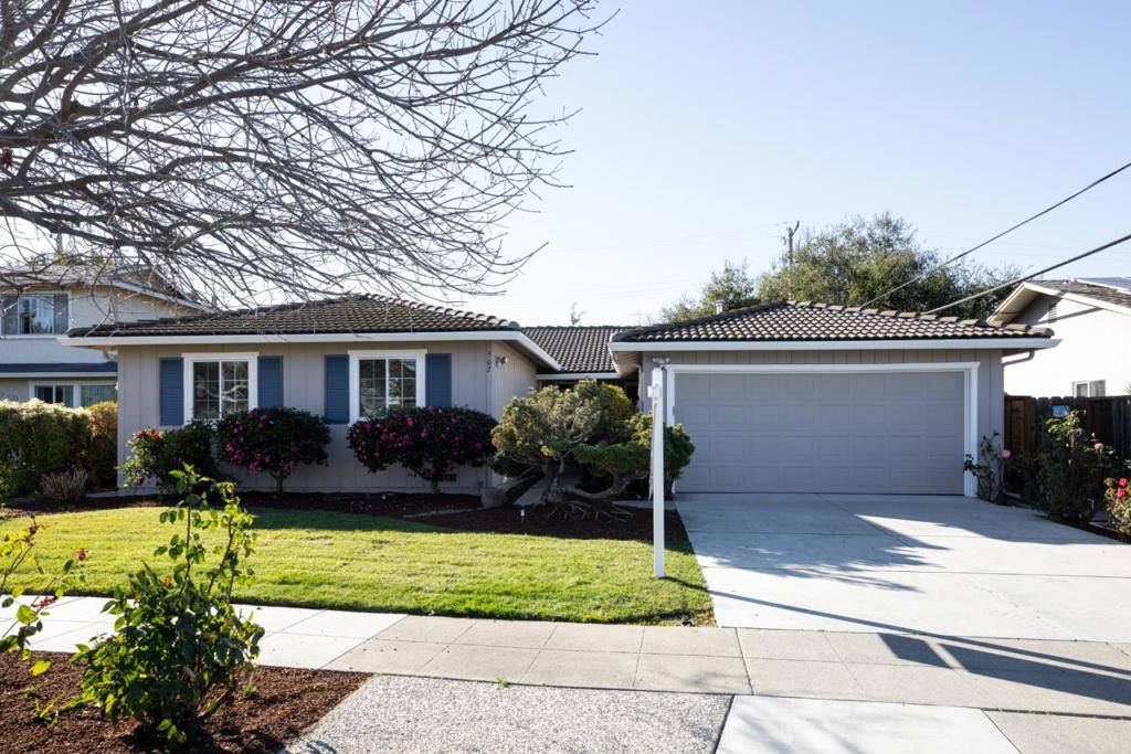 Spacious and charming single-family home nestled in the heart of San Jose perfectly designed to accommodate your lifestyle. As you enter, you'll be greeted by a warm and inviting atmosphere, accentuated by dual pane windows that allow natural light to flood the interior. The home boasts a versatile mix of carpet, hardwood, and laminate floors, complemented by recessed lighting and a skylight that enhances the ambiance. The well-appointed kitchen is a chef's delight, equipped with stainless steel appliances, including a dishwasher, electric stove, wall oven and under cabinet lighting. Enjoy the convenience of an eat-in kitchen, complete with a pantry, range hood, and windowed views. The primary ensuite bathroom offers a private retreat, while the additional bathrooms and bedrooms provide ample space for family and guests. Step outside to a covered patio area, ideal for outdoor gatherings and relaxation. Modern comforts include central AC and heating, along with a security system and video security. The attached garage provides convenient parking, and washer/dryer. Located near shopping, dining, and commute routes you will experience the perfect blend of comfort and convenience. Don't miss the opportunity to make this delightful home yours!