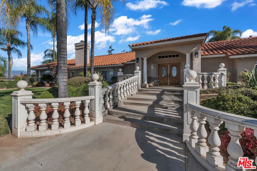 Discover the perfect blend of luxury, space, and versatility in this beautifully cared-for residence, ideally suited for multi-generational living or those seeking generous room to grow. Resting on a tranquil half-acre lot, this home offers exceptional privacy and comfort both inside and out. Inside, you'll find 5 oversized bedrooms, 4 bathrooms, and a dedicated office, thoughtfully laid out to accommodate today's modern lifestyle. Four bedrooms are connected by convenient Jack-and-Jill bathrooms, giving family members and guests their own private wings. The primary suite is a true retreat, featuring direct access to the backyard and pool for effortless indoor-outdoor living. Its recently remodeled bathroom includes a spacious walk-in closet, a luxurious soaking area, and its own cozy fireplace an ideal sanctuary at the end of the day.  Working from home? The versatile office provides the peace and functionality you need. Throughout the home, three fireplaces add warmth, character, and inviting ambiance. Step outside to your private backyard oasis: a fenced-in pool, lush mature landscaping, and expansive areas for entertaining, relaxing, or creating the outdoor space of your dreams. The three-car garage offers abundant parking, with additional room for guests or recreational vehicles. Other standout features include a newer A/C system for year-round comfort and a premier location just moments from the prestigious Redlands Country Club. With quick access to the 10 freeway, commuting is effortless. A rare opportunity to own a generous, thoughtfully designed home where luxury meets practicality.