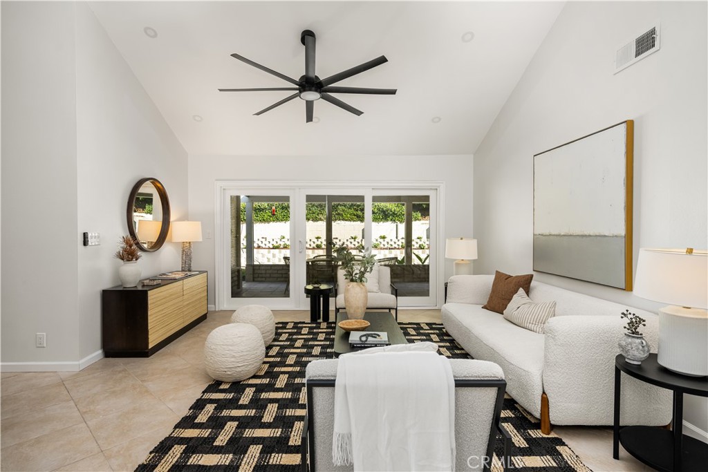 Relaxed, Modern Mediterranean Living! Step into single-level ease and effortless style at 22792 Costa Bella, where clean lines and a warm Mediterranean aesthetic define this move-in-ready 3-bedroom, 2-bath home. A double-door entry welcomes you into light-filled living and dining spaces with soaring ceilings, while tile flooring throughout adds a contemporary, coastal touch. A separate family room offers added comfort and versatility, anchored by a striking floor-to-ceiling brick fireplace—perfect for cozy evenings or casual gatherings. A thoughtfully renovated kitchen features quartz countertops, brand-new stainless steel appliances, ample storage, and serene backyard views. The spacious primary suite opens to the patio and includes a chic, updated bathroom with dual sinks and a walk-in shower. Two versatile secondary bedrooms and another fully remodeled bath complete the well-balanced layout. Additional highlights include a new roof, updated furnace, recessed lighting, modern ceiling fans, and fresh interior/exterior paint. Outdoors, imagine dining al fresco under the covered patio, enjoying the privacy of your backyard with space for activities, gardening, or simply relaxing in the sun. As a resident of Lake Forest Beach & Tennis Club, you’ll also enjoy access to an incredible range of amenities including multiple pools, tennis and pickleball courts, a fitness center, sand volleyball, basketball, and even a lakeview lounge with billiards and shuffleboard. A stylish, low-maintenance lifestyle in a vibrant community—welcome home.