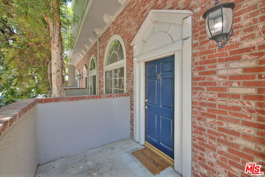 Freshly painted and move-in ready, this beautifully upgraded townhouse  with modern updates. Featuring refinished hardwood floors, brand-new carpet, and an updated kitchen with elegant marble countertops, this residence is tucked away in a quiet, well-maintained community of just 19 homes. Located in one of Northridge's most desirable neighborhoods, this spacious home offers nearly 1,300 square feet of thoughtfully designed living space. Step inside to a sun-drenched living room with soaring ceilings and oversized windows that fill the space with natural light.  Just a few steps up, the open-concept dining area flows into a bright and functional kitchen outfitted with modern appliances, ample cabinetry, and a cozy breakfast nook perfect for enjoying your morning coffee. Upstairs, you'll find two generously sized primary suites, each featuring its own private  bathroom and walk-in closet a perfect arrangement for comfort and privacy. A conveniently located laundry area and additional hallway storage complete the upper level. Additional highlights include:    Central A/C and heating    Direct-access two-car garage    End-unit privacy with only one shared wall.    Gated entry and guest parking.    Low HOA dues Set in a walkable area just minutes from Cal State Northridge, shops, restaurants, and everyday conveniences, this townhouse offers the perfect blend of location, layout, and lifestyle. Whether you're looking for your first home, an investment, or simply a stylish place to settle in, this  gem is ready for its next chapter. Could it be yours?