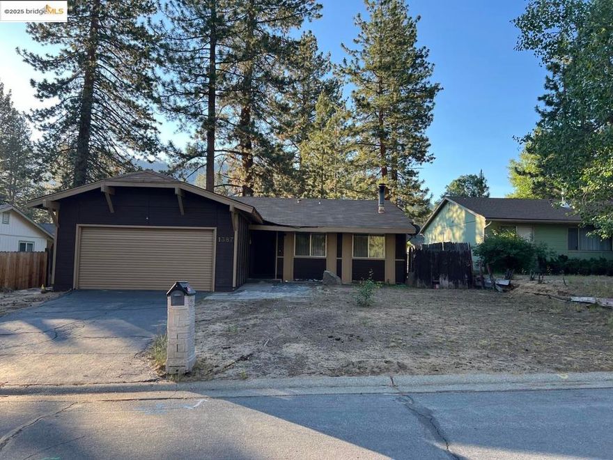 This is a 4 bedroom, 2 bath home in the private community of Pioneer Village, across the street from the South Lake Tahoe Community College. This 1,600 sq ft home has a 2 car garage and a large additional room that can be used as a Game/Fitness room or extra storage. The Property has a a mud room/laundry room with washer and dryer hookups, a wood burning stove, and a central heating system. This property is one of the only homes in Tahoe that is also wired with fiberoptics for business quality high speed internet, great for remote working and perfect for streaming services. There is plenty of storage inside and outside of the home for recreational toys and an RV.