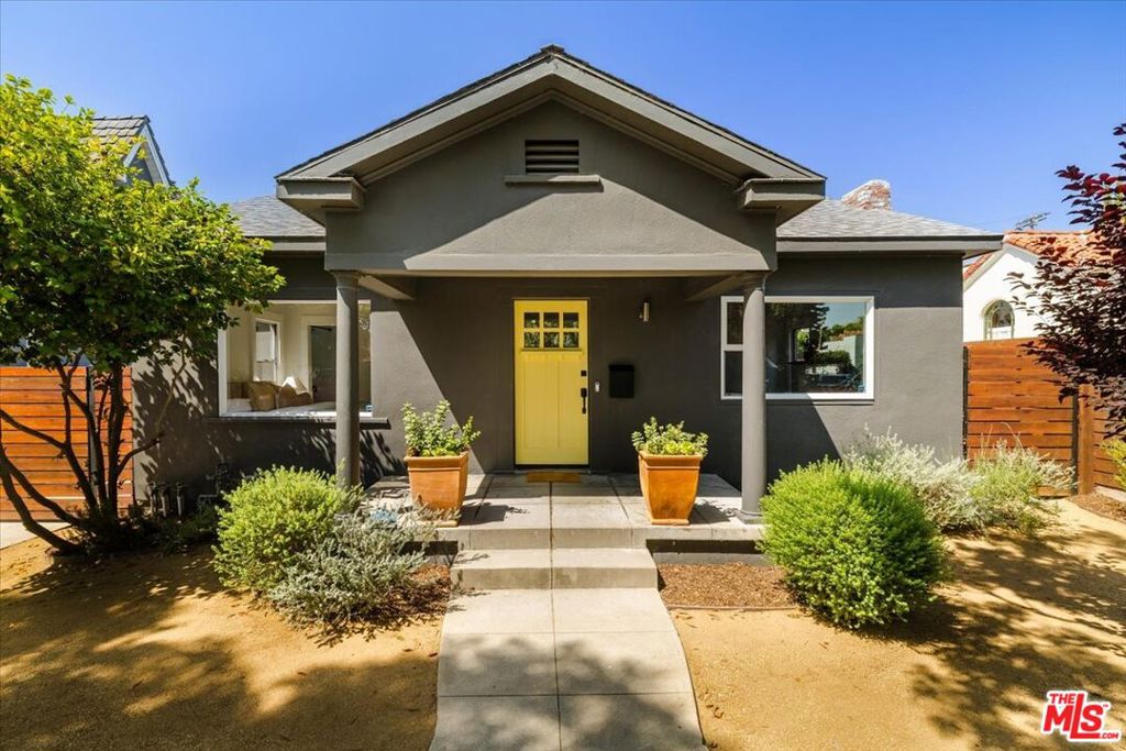 Delightful Craftsman-style cottage situated on one of the best streets in Atwater Village. This property offers a blend of vintage charm and modern convenience, situated on an impressive 6,752 square foot lot. Step inside to the sun drenched living room with large picture window and faux fireplace. Discover 2 spacious bedrooms and a beautifully remodeled bathroom that truly enhances the home's comfort and style. The heart of this home, the kitchen, shines with versatile butcher block countertops, newer stainless steel appliances and a seamless flow into a formal dining roomperfect for intimate dinners and family get togethers. Hardwood floors throughout add warmth and elegance, while the convenience of in-home laundry simplifies daily living. Outside, a private front yard and an expansive, lush backyard that invites relaxation and play. The detached garage structure offers flexible space, whether you envision a creative studio, gym, or additional storage. There's also a retro cool wood paneled 3rd bedroom/office space attached to the garage and the long driveway provides ample parking options. There are many wonderful opportunities to enhance this property. Whether you are seeking tranquility or a vibrant community lifestyle, this location provides it all with nearby shops and entertainment.