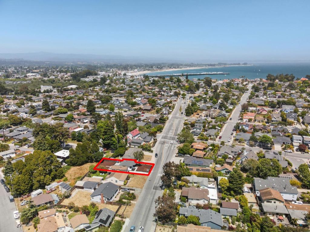 Imagine being walking distance to the beautiful west side beaches with elegant sunsets, yet still having all the convenience that Santa Cruz has to offer. Welcome to 920 Delaware Ave, a beautifully fully remodeled single level Westside gem nestled just minutes from the beach. This light-filled 2 bedroom, 1 bath home on an 5,000+ sf oversized lot offers an ideal blend of coastal charm and modern convenience. Inside, discover an open layout bathed in natural light, with seamless flow between living, dining, and kitchen areas. The kitchen is a standout, equipped with stainless steel smart appliances, modern cabinetry, and tasteful countertops; great for entertaining or cozy meals. The hardwood style finishes and updated lighting create a welcoming ambiance that complements beachside living. Outside, the spacious garage and driveway provide plenty of parking and storage. The private lot feels generous and low-maintenance, perfect for outdoor relaxation, gardening; or even an ADU. Located in the cherished Lower Westside neighborhood, you're only a short stroll from West Cliff Drive, beaches, surf spots, parks, restaurants, UCSC, and shops. With its optimal layout, thoughtful updates, and prime location, this turnkey home is perfect as a permanent residence or beach getaway!