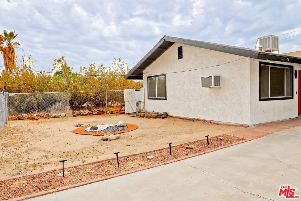 Price Reduced! Remodeled Desert Gem Near Joshua Tree. Beautifully updated home in the heart of Yucca Valley, just minutes from Joshua Tree National Park. This turnkey property blends modern design with desert charm perfect as a full-time residence, weekend retreat, or Airbnb. Features include an open layout with new flooring, recessed lighting, and a fully renovated kitchen with butcher block counters, new appliances, and stylish finishes. The spa-inspired bathroom boasts high-end touches, and a private covered patio offers ideal indoor-outdoor living. Spacious yard with room to entertain or expand. Connected to public sewer (per city records).