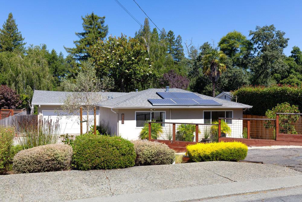 Imagine a big, sunny backyard, no neighbors behind you, and everything you need just minutes away. This desirable single-level in Scotts Valley offers comfort, privacy, and room to spread out, all on a generous 10K+ sq ft lot. With 3BRs and thoughtful remodeling to both the kitchen and bath, it strikes the perfect balance between move-in ready and full of potential. Generous windows and a slider open to a spacious yard with lush greenery beyond, while Carbonera Creek and tall fencing provides nice privacy and a natural buffer with no neighbors in sight. A covered patio extends the living space and invites you to settle into a comfy chair, sip something cold, and enjoy the simple pleasure of watching kids and pets play in the yard. Great sun exposure and fog-free Scotts Valley weather powers the solar system, and creates the perfect setting for gardening, entertaining, or even a future pool. Also an attached 2-car garage with workbench and storage above. The location is unbeatable, just a short stroll to shops, eateries, and Starbucks, and across the street from the popular Montessori school. With easy access to Highway 17 and top-rated Scotts Valley schools nearby, this is a home that offers both space and connection in a sought-after neighborhood. It's time to come home