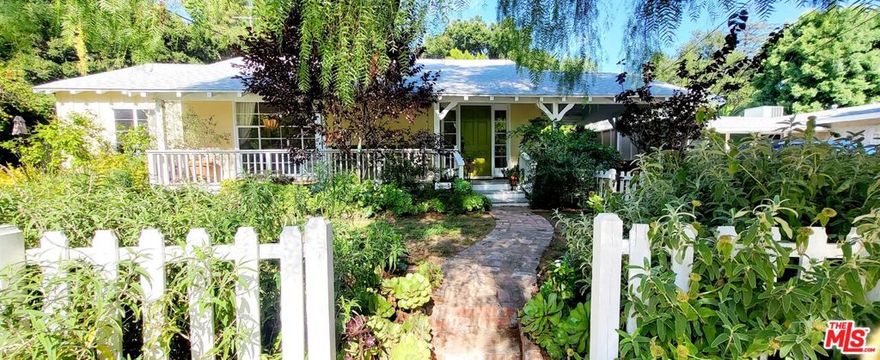 This beautifully renovated cottage is Topanga adjacent and only an 8 mile drive to PCH, without all of the hassles of actually living in the canyon. Close to the 101 and all the best that Woodland Hills and Calabasas have to offer, and easy access to Dirt Mulholland and the renowned hiking/biking trails of Topanga State Park. Recently remodeled bathrooms and an updated kitchen provide modern amenities while original built-ins, French doors and vintage steel casement windows add charm and provide views of the gorgeous gardens from every room! Complete with yoga room and hot tub, this home is a true sanctuary and sits on a peaceful and private1/4 acre lot studded with gorgeous Oaks, verdant gardens, raised vegetable beds, fruit trees and BBQ patio w/ outdoor living room. Walkable neighborhood with coffee shops and restaurants at Topanga/Dumetz. Property is available fully furnished and landlord is keeping the detached recreation room in the back for storage and private use. House is currently set up for short term rentals and is not available for showings until July.