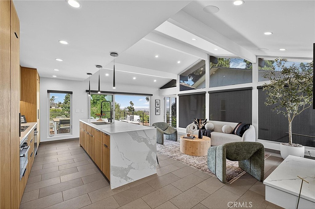 Presenting 6441 Via De Anzar ~ Step into a world of comfort, class and sophistication with this stunning 3-bedroom 3-bath residence featuring excellent overall design, flow along with an unmatched living experience. This gorgeous Resort-Styled View home is Zen inspired and features a modern flare. Upon entering through the Kerf cut flush pivot entry door you'll be welcomed by a thoughtfully designed layout featuring a spacious living room that seamlessly connects to a modern kitchen outfitted with newer high-end Miele appliances, custom Blum soft close cabinetry, Thermador refrigerator/freezer along with a beautiful kitchen island. The Fleetwood sliding windows allow for a seamless transition between indoor and outdoor living. The open-air entertaining deck spaces are perfect for al fresco dining, morning coffee, or sunset cocktails. A stunning blend of style and function, this home features a designer-inspired open floor plan and premium finishes that elevate every space along with a warm family home feel. All three bedrooms are spacious and feature rear yard/deck access points. The resort-styled primary retreat features a massive walk-in closet, a spa-inspired walk-in En-Suite bath, dual sinks, Kohler Numi smart toilet, large soaking tub, Kallista custom black matte fixtures and a Seura mirror TV. The home is adorned beautifully & adjusts to any lifestyle from the family/kids study-play area, to the sophisticated adult entertaining space. Take notice of the massive storage cabinet space on the lower level along with a dedicated tech room and a separate fire rated safe/storage room. Additional features include professionally installed and fully integrated smart home iPads controlling much of the home along with the Sonos indoor/outdoor speakers, brush nickel aluminum windows with custom rollup blackout shades, air conditioning and a mini split in the garage, automated smart water monitor shut-off, Wi-Fi leak detector, Lutron smart Wi-Fi switches, my Q smart garage door opener, Nest protect smart smoke, CO2 detectors / thermostats and a Honeywell ADT alarm system. The Home Commands Attention at every corner. Come take a look at this Stunning Residence !!!