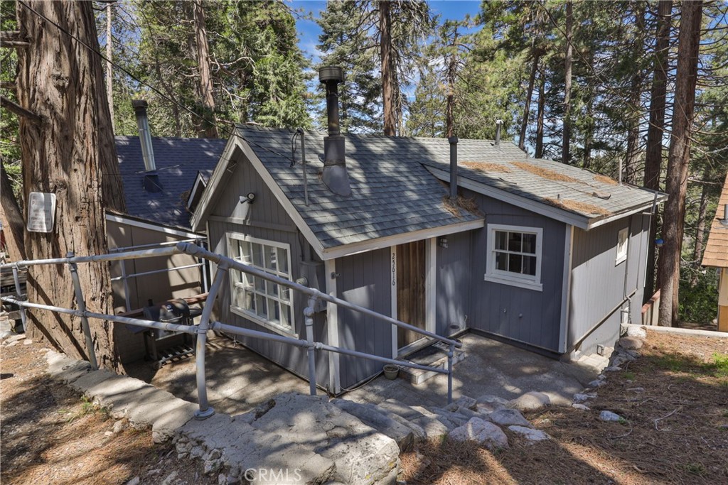 Welcome to 25616 Hi Lane—a cozy mountain getaway in the heart of Twin Peaks. This 2-bedroom, 1.5-bath home offers a warm and inviting living room with a wood-burning fireplace and an attached dining area that flows into the bright kitchen, complete with a refrigerator and stove. Laundry hookups are included, and some furnishings may stay. Step outside to a spacious deck—perfect for entertaining or enjoying the crisp mountain air. With off-street parking and a peaceful setting, this home is ideal for full-time living or a relaxing weekend escape.