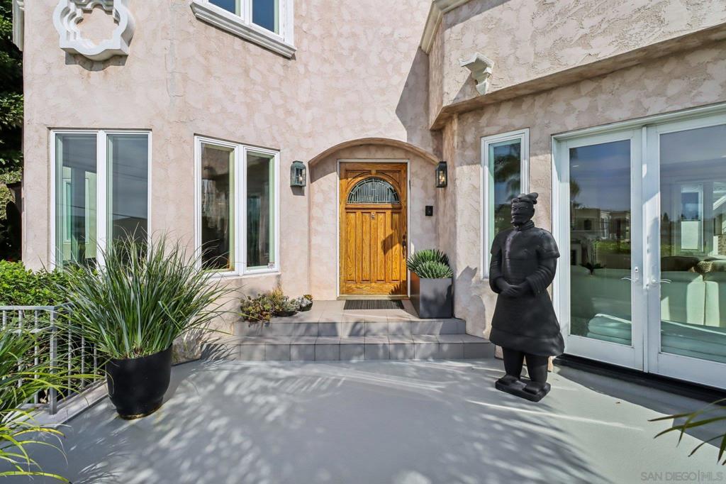 Welcome to 1295 W Redwood St, a rare South Mission Hills/Middletown gem offering exceptional space, versatility, and breathtaking views. This expansive residence boasts a flexible floor plan with multiple living, dining, and family rooms, a dedicated office, and generous flex spaces. A spacious front terrace leads to the formal entry, opening to a grand living room with a fireplace and water views, and an elegant dining room. An additional living and dining area off the gourmet kitchen—complete with a center island, custom cabinetry, high-end stainless appliances, and breakfast seating—connects to an outdoor terrace perfect for entertaining. Upstairs, both formal and service staircases lead to the oversized primary suite featuring panoramic bay and downtown views, a fireplace, dual walk-in closets, and a spa-like bath with soaking tub, walk-in shower, and dual vanities. Four additional bedrooms, three ensuite, provide comfort for family and guests. The lower level offers a private living space with a living room, dining area, kitchenette, storage room, and separate entrance—ideal for multi-generational living or guests. Additional highlights include owned solar, dual HVAC systems, and Quieter Homes Program upgrades. Plus, a potential opportunity to purchase the almost 3,000 sqft vacant lot next door to create the backyard of your dreams. Perfectly located near Mission Hills, Little Italy, Downtown, and the waterfront, with easy freeway access to beaches, the airport, shopping, dining, and nightlife, this home blends luxury, convenience, and unmatched views.