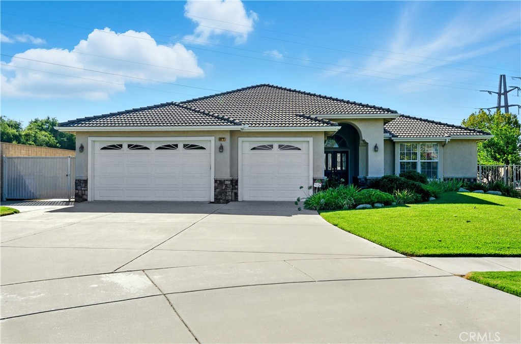 Idea Upland single-story home on a Cul-de-sac located in the desirable Chaparrel Heights. 4 bedrooms, 3 bathrooms just under 3000 sqft on a 11,110 sqf lot. Kitchen is open to the nook and large family room with a fireplace. Living and dining rooms are spacious. Crown Moulding and coffered ceilings bring elegance to this home. All bedrooms are large enough to accommodate queen beds. Primary bedroom can easily fit a king bed and additonal pieces. En-suite bathroom features a soaking tub, separate shower, dual sinks and a large walk-in closet. Indoor laundry has ample storage and a sink. 3 car garage and large driveway allows for plenty of parking and storage. Backyard is very private with a large covered patio. Block walls all the way around. Back up Generac Generator provides power in case of power outages. Water circulator on water heater. Alarm and central vacuum. Make this well-loved home yours.