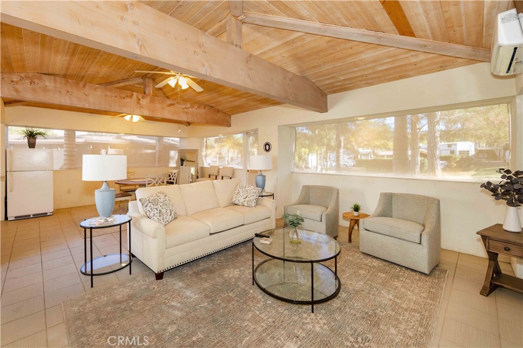 Beautiful Fully Enclosed +-630 Sq Ft Buildout with Quality Super Construction - Spun Fiberglass and Green Wall Drywall for extra protection from ware and tear. Back Yard is all common area and ready for a quick game of bag toss or frisbee in a Huge Grassy Knoll with a perfect sitting area to watch the games. Lots of Trees for Shade and Privacy Hedges for great curb appeal. Inside this beauty is 3 living areas, Large Family Room, Dining Room and Kitchen with full fridge, Stove/Oven, Storage and counter top microwave and toaster oven. Floors are easy to clean tile and the roof is Clay Tile meant to last. Included in Rancho California RV Resort is a 14 hole Executive Golf Course that is free for owners, 5 Pools and Jacuzzi areas, Tennis Courts, Pickle Ball Courts, Laundry Rooms, Dog Park, Horse Shoe Lawn, Club House, Hiking Trails, and Restaurant all inside Gated Community that is Guarded 24/7. You can live here or rent your space. Peace and quiet serenity all just 25 minutes from Temecula Wine Country. No age restrictions. Come on over and check this hidden gem of a place out...