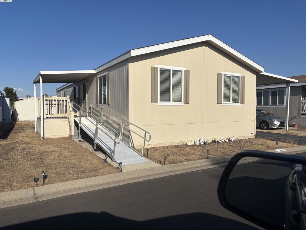 Popular Friendly Village 55+ Park! Access ramp to front door provides handicap access to a cheerful & bright "Great Room," an excellent gathering place for the whole family! Inside laundry room, Shed out back included. Covered carport for multiple vehicles! Check out this friendly Park's Pool, Clubhouse & fitness center & billiards room. Close to shopping and many restaurant options! Highly MOTIVATED & Helpful Seller willing to help with buyer's closing costs.! Fireplaces: NO