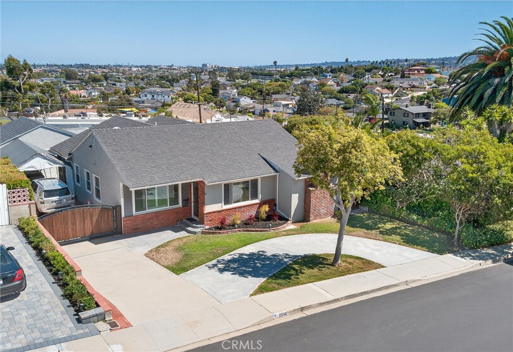Elevated in South Torrance’s prestigious Seaside neighborhood, this turn-key 3-bedroom, 2-bathroom home blends charm, comfort, and captivating city views. Remodeled in 2011, the home boasts refinished hardwood floors, a beautifully updated kitchen with granite countertops, and a welcoming family room with a cozy fireplace. The spacious primary suite offers dual entrances, private access to the backyard, a walk-in closet, and an en-suite bath with a separate shower and toilet area. The thoughtful circular floor plan creates an easy flow, with bedrooms and a shared bathroom on one side, and the laundry area with additional backyard access on the other. Step outside to a custom-built deck where you can enjoy peaceful morning sunrises or relax in the evenings, surrounded by a backyard that offers both privacy and stunning views. Detached 2-car garage is the perfect man-cave with a long driveway and an electronic gate. Conveniently located near the beach, award-winning TUSD schools, shopping, and dining, this home offers the ultimate balance of lifestyle and location, your dream home awaits!