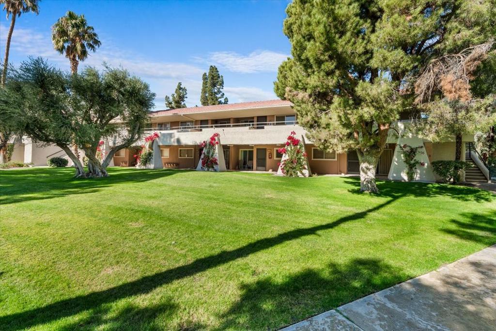 Experience the best view in Palm Springs Villas from this charming 1-bedroom, 1-bathroom condominium. Perfectly positioned, this home offers an unobstructed and truly breathtaking vista of the sparkling pool framed by majestic mountain backdrops--widely admired as one of the most beautiful outlooks in the community. Step inside to discover a thoughtfully updated retreat featuring plastered ceilings, fresh paint, and modern touches throughout. Stay comfortable year-round with a new AC Nest system and enjoy peace of mind with a built-in ADT security system. The upgraded bathroom adds convenience and style, while the dining area is elevated by a chic mirrored wall that reflects natural light. The cozy living room flows seamlessly to a covered balcony, where you can relax and soak in those stunning mountain and pool views--just a quick step down offers immediate pool access for ultimate ease. From its prime second-floor location, this unit captures a-perspective that feels both private and inspiring. Practical perks include covered parking and access to resort-style amenities such as swimming pools, spas, and tennis courts. Ideally situated near the Palm Springs Visitors Center, Aerial Tramway, Marilyn Monroe statue, and Palm Springs Art Museum, this is the perfect combination of comfort, style, and location. Don't miss the opportunity to make this spectacular view condo your own oasis in Palm Springs!