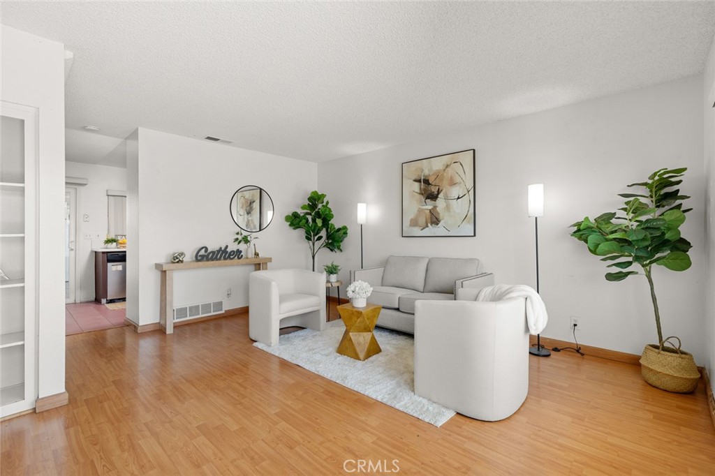 Nestled in the vibrant heart of Little Saigon, this charming 2-story townhouse offers an unmatched blend of comfort and convenience. Located just 5 minutes from My Thuan Market, you'll find an array of grocery stores and delightful Vietnamese and Korean restaurants right at your doorstep, allowing you to savor the local culture and cuisine without the hustle.
This home welcomes you with a cozy living room and bedrooms accented by laminate flooring, offering both comfort and easy maintenance. The kitchen stands ready for your culinary adventures with its sleek white Corian countertops, modern stainless steel appliances, and practical tile flooring.
Upstairs, two spacious bedrooms and a full bath provide a private retreat for relaxation. Central AC ensures a pleasant climate year-round, while a generous 2-car garage offers ample storage and parking.
The outdoor spaces, including a covered patio with tile flooring, are perfect for leisurely afternoons or entertaining friends. As part of a welcoming community, you're invited to enjoy amenities such as the sparkling pool and bustling basketball court.
This townhouse is not just a home; it’s a gateway to a vibrant lifestyle, ideal for those looking to immerse themselves in all that Little Saigon has to offer.
