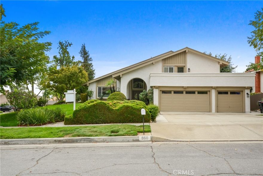 Welcome to this beautifully remodeled multi-level home in the highly desirable North Upland community. This stunning property offers 4 bedrooms, 3 beautifully remodeled bathrooms with modern finishes, and a 3-car attached garage offering plenty of parking and storage space, with stylish upgrades and functional features that make it ideal for both everyday living and upscale entertaining. Stylish, fully updated kitchen with quartz countertops, stainless steel appliances, kitchen island, and ample storage. Upstairs, each bedroom is generously sized, including the luxurious primary suite featuring a private balcony overlooking the front yard and view of the mountains, walk-in closet, dual vanities, and a custom walk-in shower in the en-suite bathroom — perfect for unwinding in style. Ideal for guests or multi-generational living, this home includes a main-floor bedroom and bathroom, offering flexibility and convenience rarely found. Bright and open floor plan with formal living room, formal dining room, and cozy family room with custom wet bar, built-in wine fridge, fireplace, French doors leading to a peaceful lattice-covered patio and private back yard, perfect for relaxing or entertaining. Recessed lighting and SPC Vinyl flooring throughout. Convenient indoor laundry room with storage cabinetry and under mount single basin utility sink with cabinet. Freshly painted interior and exterior for a clean, updated feel. Situated on a corner lot in a peaceful, well-maintained neighborhood. Schedule your private tour today! ***Seller offering RATE BUY-DOWN with the right offer!!!