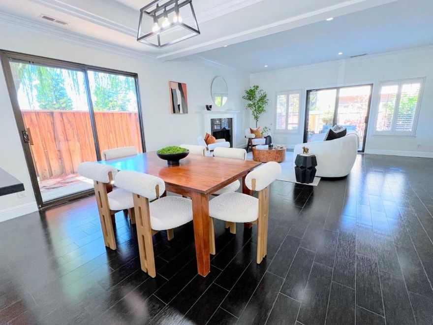 One of the largest 3 bed townhomes. Spacious 1,618 sq ft.  Renovated, contemporary design. Open floorplan with great flow for cooking and entertaining. Elegant tile flooring is both practical and modern. Kitchen is bathed in sunlight: lots of cabinets, natural stone countertops, and stainless steel appliances. New appliances, 5 yrs old. Tray ceilings & recessed details, enhanced by color-changing LED lights, add architectural interest. This corner home has natural light filling the space through expansive windows, sliding glass doors on two sides, and a large skylight. Recessed lighting provides a warm ambiance day or night. Practical floorplan with upstairs laundry area and three bedrooms. Oversized primary suite with a luxurious en-suite bath, double vanity, elegant LED  lights, modern black matte slim profile mirrors, and pre-wiring for a ceiling fan. Primary bedroom can accommodate a large king mattress plus room for computer desk. Private, extra-large wrap-around yard with patio for entertaining. HOA amenities swimming pool, tennis court, play area, club house, and walkway along lagoon. HOA covers water, sewage, garbage, roof, fence, exterior, etc. Great location, near FC Elem School, and  bus stop to middle & high school. Great condition and clean reports. Ready to move-in.
