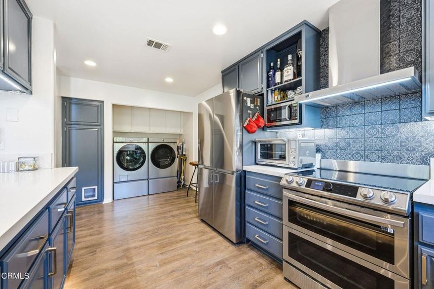 Located in a secure gated community. The kitchen showcases new Samsung Bespoke Collection appliances with SmartThings functionality for a truly intelligent culinary experience.  Generous rooms with a warm, inviting ambiance make this home a rare find in the area. Vaulted ceilings add an expansive, airy feel throughout.   Modern enhancements include a brand-new AC unit with a heat pump system and completely upgraded ductwork, enhanced electrical work, quartz countertops, and luxurious Horow smart toilets to name a few.Tucked into one of the quietest areas of the complex with a tree lined view, this home provides exceptional privacy and serenity.Enjoy the small-town feel with big city conveniences, including shopping, dining and community spaces-all just steps from the new High Street Depot in downtown Moorpark!