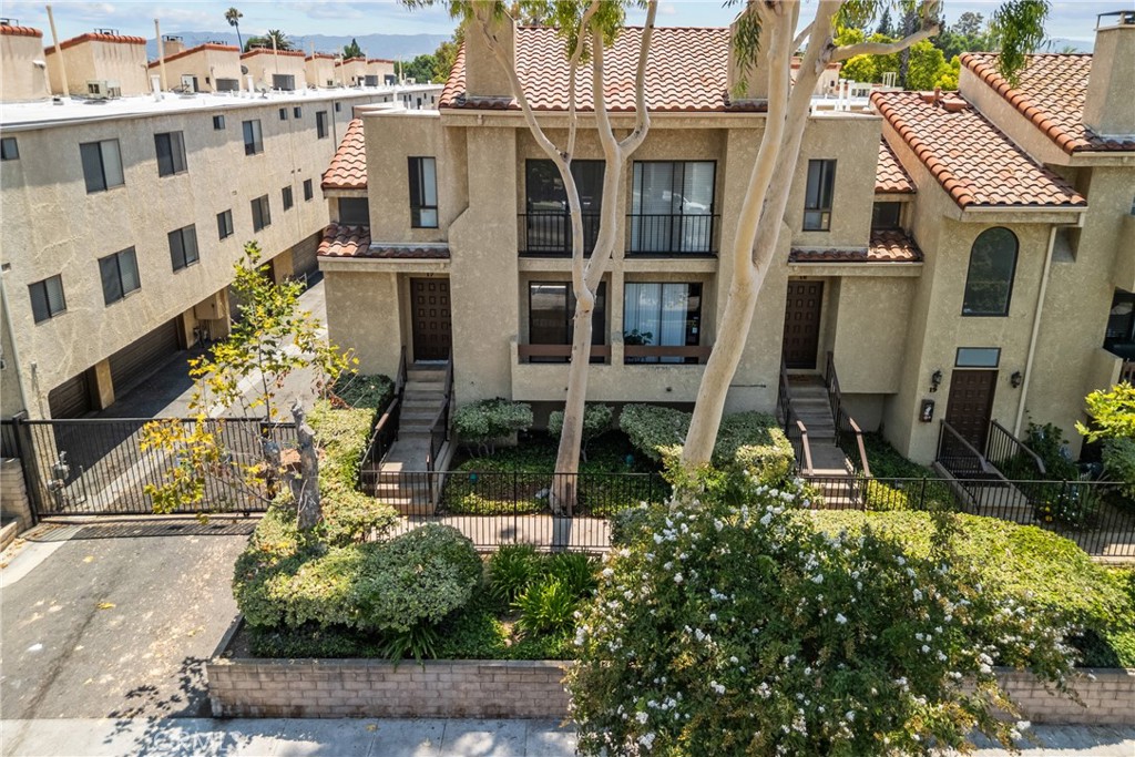 Stylish Updated 2 BR/ 2.5 BA Townhouse with approx. 1,095 sq.ft of living space. Privately tucked into a secure, gated complex in the heart of Reseda, this tri-level home features a remodeled kitchen with quartz counters and sleek cabinetry, laminated wood floors throughout, and a cozy fireplace in the living area. Master suite with private bathroom and high vaulted ceilings. Updated Bathrooms, Central A/C & heat. The attached 2-car garage provides secure parking and laundry area.