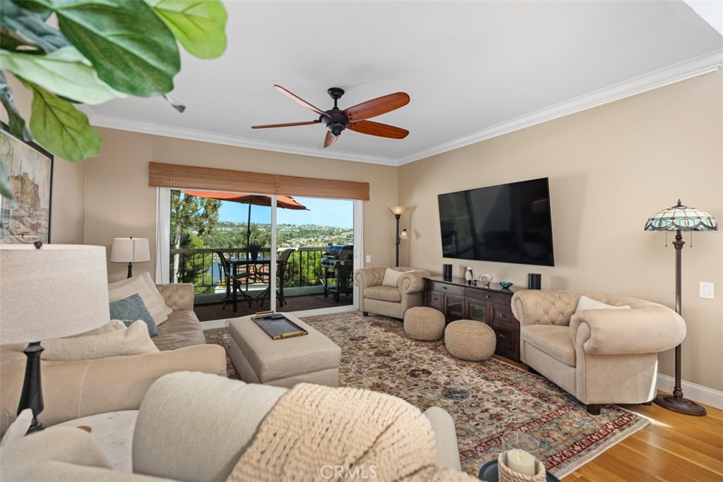 ONE OF A KIND PROPERTY - RARELY ON THE MARKET - LAKE MISSION VIEJO & MOUNTAIN VIEWS - RESORT LIVING IN SOUTH ORANGE COUNTY. Everyday melts all your problems away and feels like you are on vacation. Welcome to Mallorca by the Lake, where the views are panoramic and the lifestyle feels like you’re permanently living at a resort. Because...well...you are. You won't find another community like this in all of Orange County. Before you walk in the front door, you're greeted by a serene courtyard, with a sitting area, flowers, potted plants, and a remote controlled retractable awning to add that extra shade on a hot day. As you enter through the Dutch door, you're immediately greeted by a beautifully decorated home with the promise of something special around every corner. In this GORGEOUS remodeled townhouse, experience the natural light pouring in from the skylights and clerestory windows onto the open floor plan. The living and dining spaces flow effortlessly to a balcony that serves up panoramic views of Lake Mission Viejo, rolling hills and Saddleback Mountain—perfect conversation starters for coffee at sunrise or wine at sunset. The crisp kitchen has been remodeled with a double door oven, new fridge, cabinets with custom pullouts and a bright bistro area that overlooks your flowery courtyard. Your spacious primary suite is a true retreat with His and Hers closets, skylight spa-style bathroom, and double-sink vanity for stress free mornings. Downstairs, you’ll find two more bedrooms and an updated bathroom. One room doubles as a home office with its own patio, while the other hides a secret storage area behind the closet—because even paradise needs a "speakeasy." The two-car garage offers direct access, finished floors, washer and dryer hook-ups, plenty of storage and even a full driveway. PLUS a rare bonus-a newly installed EV charging station. You may not want to leave, but if you do, the Mallorca community spoils you with two pools, a jacuzzi, boat docks, 24-hour gated security, your own private beach AND as a Lake Mission Viejo member, you’ll enjoy boating, paddle boarding, fishing, concerts under the stars, lakeside movies, festive holiday events, and more. If you are looking for a home that is once in a lifetime, this is the one. Call your agent today to see this spectacular listing!