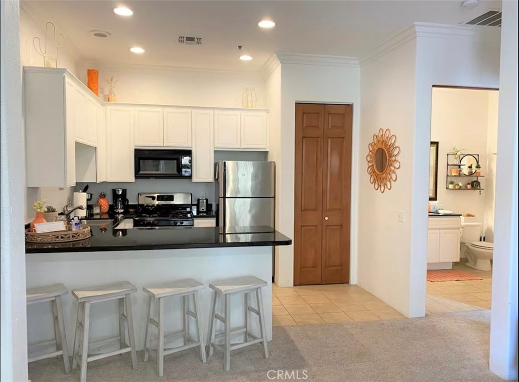 *****STVR APPROVED PROPERTY*****. LOCATION LOCATION LOCATION!! This furnished condo, in the highly desirable Casitas Las Rosas in Old Town La Quinta, awaits as your new home, vacation spot, or investment property! Walk across the street into old town; boasting restaurants, bars, coffee shops, ice cream, shopping, and La Quinta Brewery. Minutes to the La Quinta Resort, world class golf, Indian Wells Tennis Gardens, and host to Coachella and Stagecoach Festivals; Indio Polo Fields. This is a gem of a spot. Only a couple of hours drive from LA or SD, this location creates the ultimate staycation location. With 5 pool and spa areas on the property, you don't have to go far to stay cool in those summer months! Enjoy mountain or pool views from anywhere in the complex. This first floor condo is available for private showings starting Sunday July, 13th! Schedule yours today!
