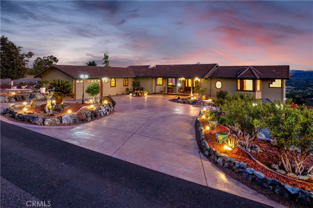 Shared Lake Access Option at Park approximately 1/2 mile nearby. Large 4,132 sq ft, custom home, with many upgrades. Three bedrooms; a nursey room and & an office; 3 Full & 2 partial bathrooms. Primary Suite in West wing, approx. 25' x 16' flows into lavatory, double sinks with granite counters, wrap around glass shower & walk in closet. East wing has a second large & one smaller bedroom with gorgeous 4 years new Jack & Jill bathroom with shower. Stunning views of Clear Lake from Mt Konocti Riviera Hills over Kelseyville & Lakeport, to Scotts Valley pear orchards. Dining room with sculpted ceiling is 13' x 14' with French doors to covered deck. Third bathroom in hallway with shower. Kitchen with Breakfast Nook is open to Family Room with cozy gas fireplace. Central Vacuum both levels. Laundry has Granite Counter & Deep Stainless sink with storage galore. This area is used as Butler's Kitchen when preparing for Parties of 65 - 85 guests in Downstairs Gaming & Party Room of approx. 838 sq ft. Party room features 360 degree Panoramic Mural by professional local artist!! Handsome 16' L-shaped wet bar has convenient nearby lavatory. Sliders in Party Room lead to lower-level deck & tranquil Hot Tub in which to relax, breath the clean air, watch stars & satellites glide by over the lake. Convenient attached single car garage at main house, plus detached three car garage with sink & toilet. Detached 20' x 40' Metal Outbuilding is used as RV storage. Abundant off-street parking on base rock & stamped cement. Extensive landscaping dominated by Magnolia trees, oleanders, roses, potted geraniums, various shades of decorative rocks, and succulents. Home on public water, septic & has three individual heat & air conditioning regions. Home has alarm system. Sutter Hospital Lakeport is approx. 5 minutes nearby!!