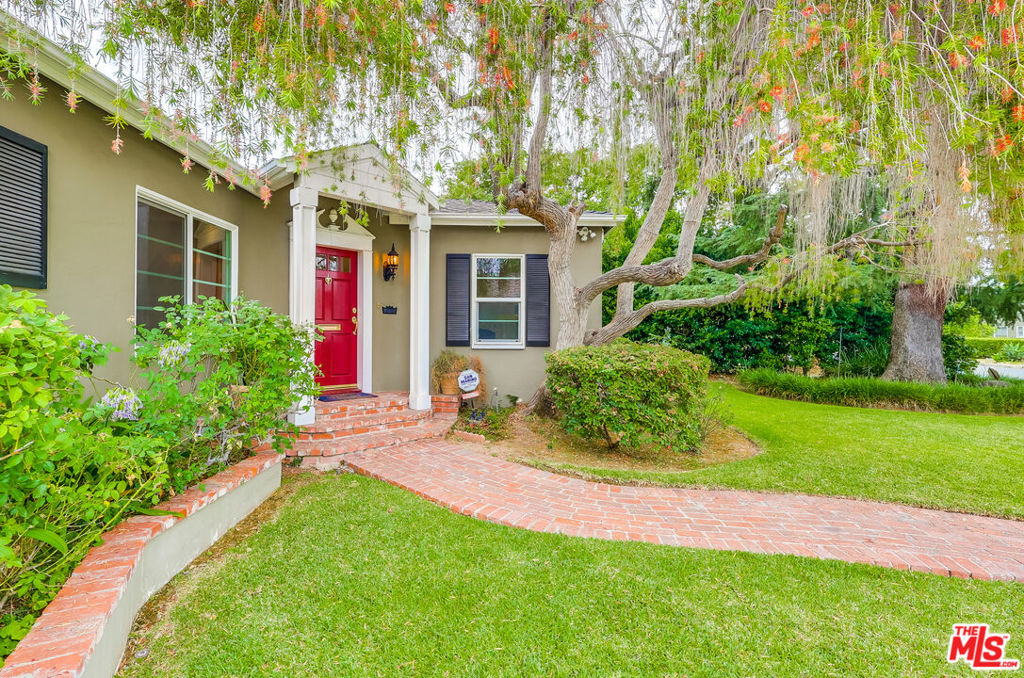 Located in one of North San Gabriel's most sought-after neighborhoods, this extensively remodeled traditional home offers generously sized living spaces and beautifully maintained grounds. Inside, you'll find a formal living room with fireplace, a separate dining room with classic wainscoting, and a bright, spacious kitchen equipped with built-in appliances, a breakfast area, and a dedicated butler's pantry. The adjoining secondary living room is designed for comfort and entertainment, featuring surround sound, a built-in TV, fireplace, and French doors that open to a covered outdoor dining area with its own fireplace. The primary suite is a standout, offering vaulted ceilings, French doors to a private outdoor sitting area, and a luxurious marble bath with dual vanities, a soaking tub, walk-in shower, and large walk-in closets. Set on an oversized lot, the property includes mature landscaping, tall trees, and two additional structures: a detached artist's studio and a separate guest house (not included in the official square footage). Additional highlights include oak hardwood floors, built-in speakers, three-zone central heating and air, three fireplaces, newer windows and roof, updated lighting, alarm system, large attic, and clean basement.