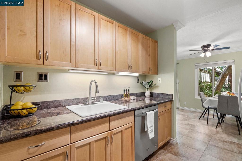 This beautifully updated split-level 2-bedroom condo offers the perfect blend of comfort, style, and convenience. Step inside to discover a stunning remodeled kitchen with rich maple cabinets, pull-out drawers, sleek granite countertops, and stainless steel appliances—ideal for cooking and entertaining. The open layout is enhanced by easy-care tile and laminate floors, elegant crown molding, and energy-efficient dual-pane windows that flood the home with natural light. Upstairs, two spacious bedrooms await—one with a walk-in closet, the other with mirrored closet doors. The private balcony is ideal for relaxing mornings or quiet evenings, and is nestled among serene, mature vegetation. Located in a prime Walnut Creek neighborhood, you’re just minutes from top-rated schools, the Iron Horse Trail, Walden Park, Pleasant Hill BART, major freeways, Bay Club, shopping, and dining. This move-in-ready gem combines urban convenience with suburban charm. Schedule your showing today—homes like this don’t last!