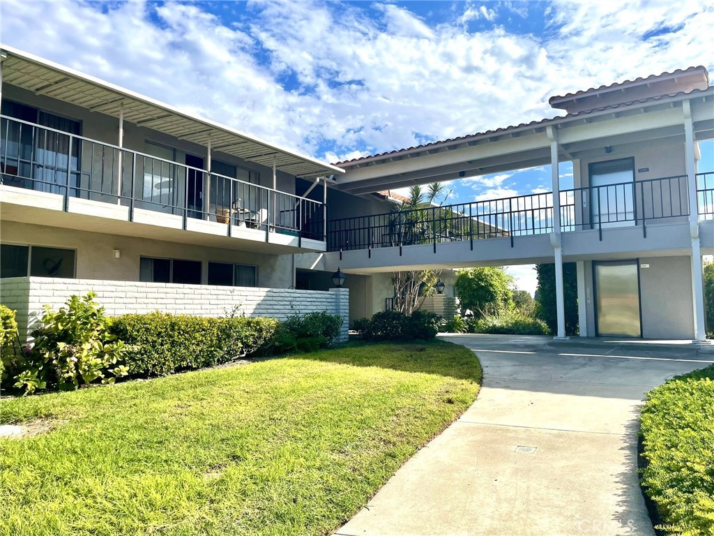 Resides in 24hr guard gated community of Laguna Woods, this “Contenta Royale” model 2 beds 2 baths condo is a bright and clean unit on top of the hill that has cool breezes with tranquil living. “No Steps Required” as an elevator resides next to carport.  Open floor plan with new paints and new vinyl flooring throughout.  Both bedrooms have spacious closets.  Master bathroom has step-in shower.  Hallway bathroom features a tub/shower combo with hand-held water fixture and safety handrails. Both bathrooms are equipped with low flow toilets.   Large and covered balcony has lots of room to entertain.  Just a couple of blocks from Clubhouse 4.  Close to shopping malls, medical centers, restaurants and highways; Near beaches, close to the bustling city of Irvine.  The HOA of Laguna Woods provides free bus services, 27-hole golf courses, tennis courts, 5 swimming pools, spas, 7 clubs, gymnasiums, performing arts theatres, more than 200 clubs to network with. Don’t miss the incredible opportunity to own this well-located sweet home!