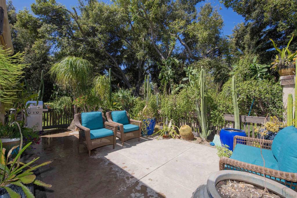 Charming 2 Bed, 2 Bath Condo with Vaulted Ceilings and Outdoor Retreats! This well-maintained home features vaulted ceilings in both the living room and primary suite, a spacious kitchen with granite countertops, travertine flooring, and an island sink. Enjoy the convenience of indoor laundry. The updated primary bath includes a rain shower, and the second bedroom with a Murphy bed is ideal as a guest room or office. Recent upgrades include a new HVAC (2024) and roof (2025). Enjoy a private balcony off the primary suite and a peaceful patio surrounded by lush greenery—perfect for morning coffee or sunset dining. The community offers resort-style amenities: golf, pools, tennis/pickleball, trails, dog parks, equestrian centers, restaurant/bar, guest lodging, and RV/boat storage. A rare find—don’t miss it!