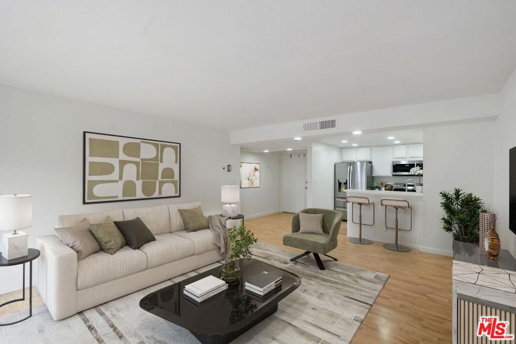 Don't Miss this Amazing Opportunity to Own a Beautiful, Comfortable, Light, Bright, Newly Remodeled, Luxury Condo at the Wilshire Marquis in Westwood on the Highly Acclaimed Prestigious Wilshire Corridor! Rich Dark Wood Entry Doors Open to this Quiet End-Unit with many Unique Features such as the Recently Updated Kitchen with New Stainless Steel Appliances, New Recessed Lighting, New Granite Counter-Tops, Rich Wood Floors, an Open-Concept Layout with a Spacious Living Room, Cozy Dining Room, Breakfast Bar, and Wet-Bar Facing the Balcony overlooking the newly tiled- Deck on the North. The Primary Bedroom is well-equipped with Custom Shelving in the Walk-In Closet and the Secondary Bedroom also offers versatile well-crafted shelving. The convenient Stack Washer-Dryer is conveniently accessible from the Hallway inside the Unit. The entire condo is immaculately clean and Move-In ready. Resort-Style Building Amenities include a Front Desk Concierge/Switchboard, 24 Hour Security, Gated Community Parking, Ample Guest Parking, Electric Car Charging Stations, Heated Olympic-Size Lap Pool, Sauna, Spa, BBQ Area, Garden Patio for Outdoor Dining, a Fitness Center, 3 Tennis Courts (2 on the Roof) and a Multi-Purpose Room on the Deck Level and an Extra Community Storage Room on each Parking Level. Conveniently Located Near UCLA, the Wilshire Marquis is also adjacent to Beverly Hills, the 405 Freeway, Public Transportation and Local Theaters, Libraries, Museums, Restaurants, Entertainment and Shopping. We look forward to meeting you for a tour of this lovely impressive condo and Premises!