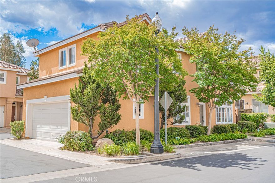 Welcome Home! Featuring a stunning Montevista home situated in one of the most desirable newer communities in Valencia. With an open floor plan that seamlessly connects the living spaces, making it perfect for both daily living and entertaining, you do not want to miss this one! Home features three bedrooms and two and half baths, upgraded laminate wood flooring, window treatments, fresh paint throughout, mirrored closet doors in all three bedrooms, upstairs laundry and attached two car garage. Enjoy cozy evenings by the fireplace with custom mantel and built in media niche in the living/family room. The chef's kitchen is equipped with top of the line newer stainless steel appliances, ample cabinet space including large pantry, kitchen nook and sliding doors out a low maintenance, cozy patio. Light and bright formal dining area provides opportunity for those special moments shared with family and friends. The primary bedroom offers a walk in closet plus a large secondary closet with beautiful mirrored doors. Upstairs bathroom(s) include elegant Corian counters, beautiful stone tile flooring with bathtub and shower in each and extra cabinetry ensuring both functionality and style. One of the lowest HOA combos in Valencia, close proximity to schools, indoor/outdoor shopping, Valencia's 20 mile long paseo system, and freeways.